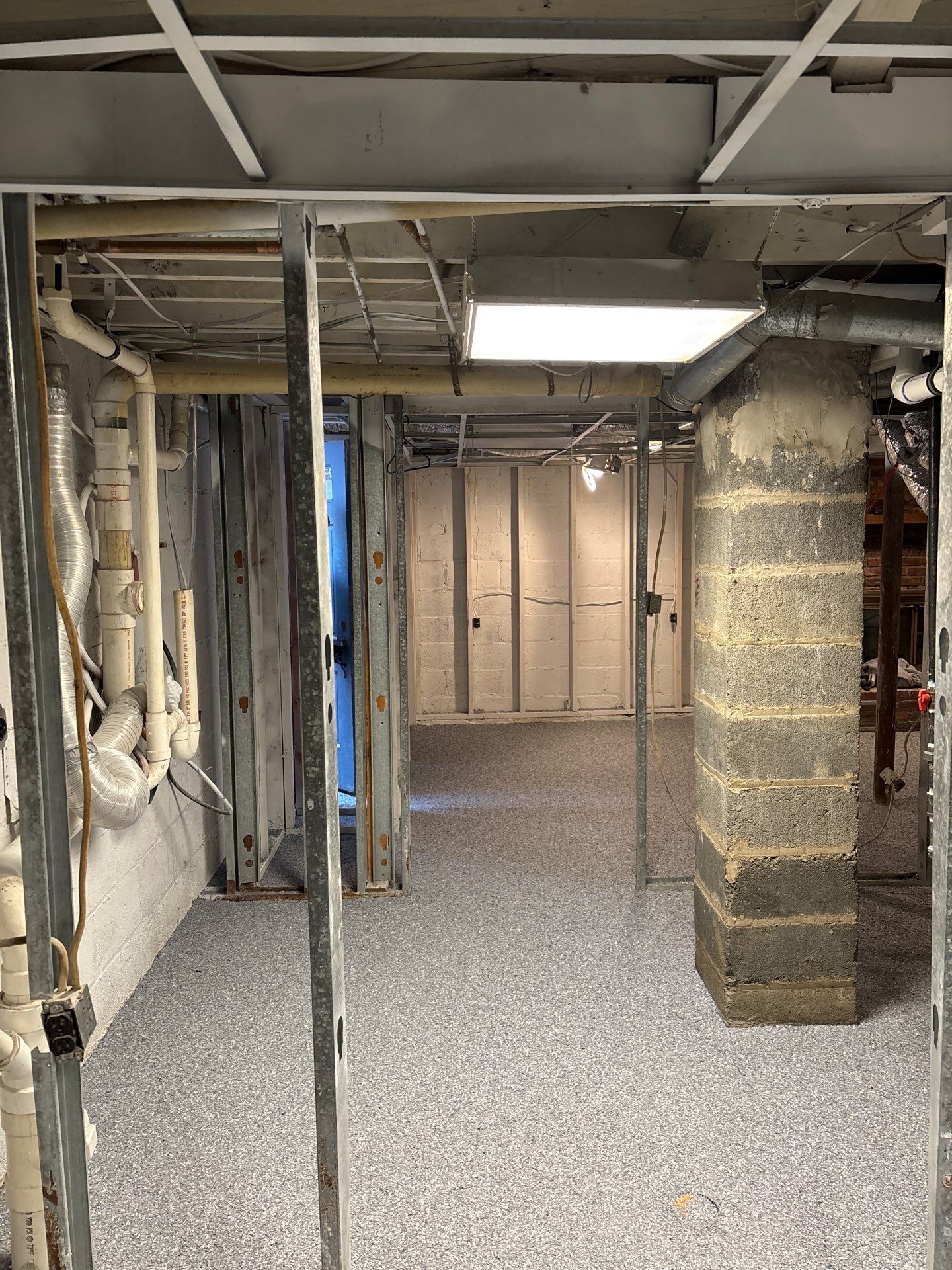 Basement Concrete Floor Coating with Penntek Flake System by Spectrum Painting, LLC
