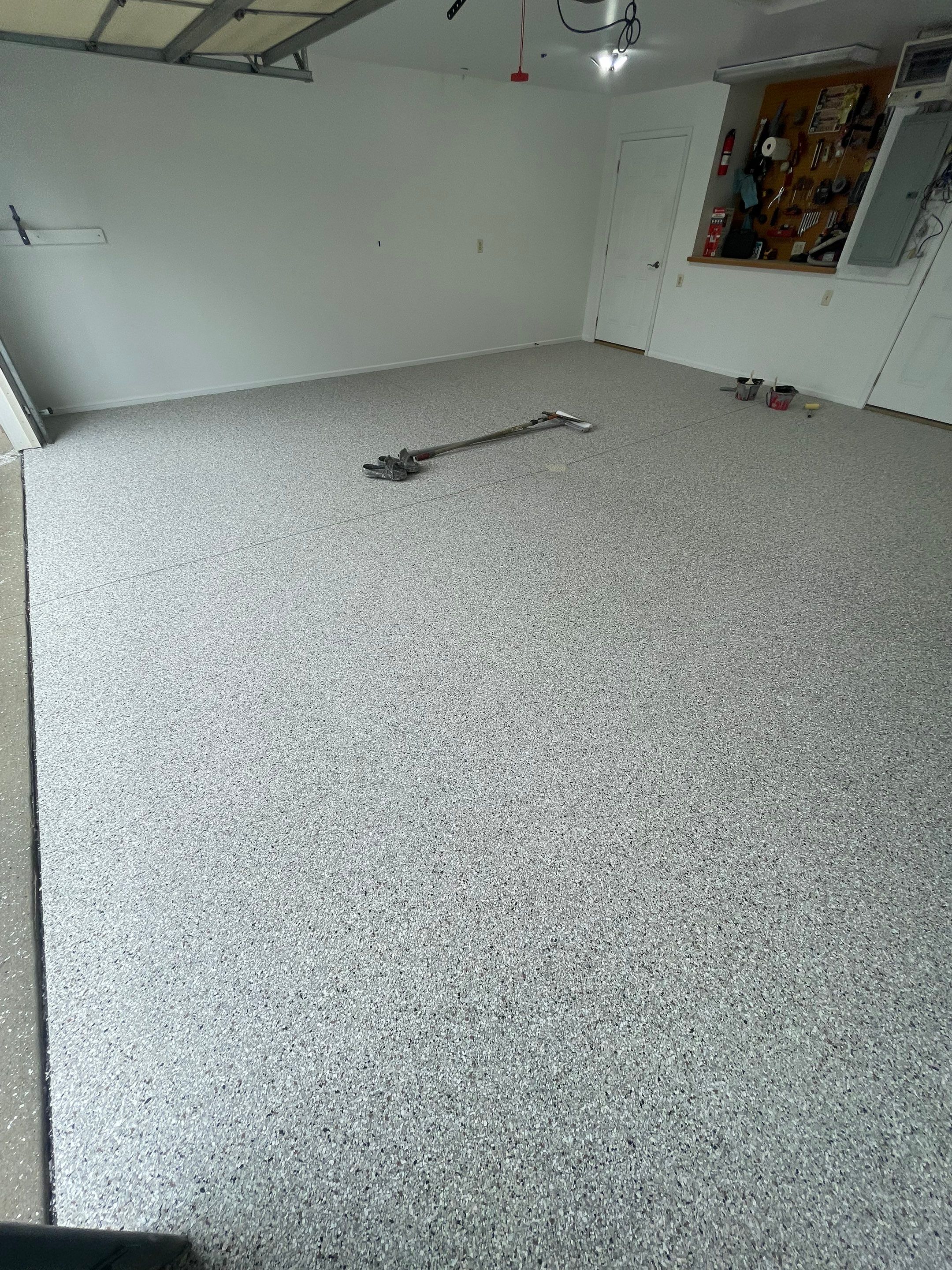 Coyote Flake Garage Floor Coating in Worthington, Minnesota by Select Painting, Coatings & Garage Cabinets