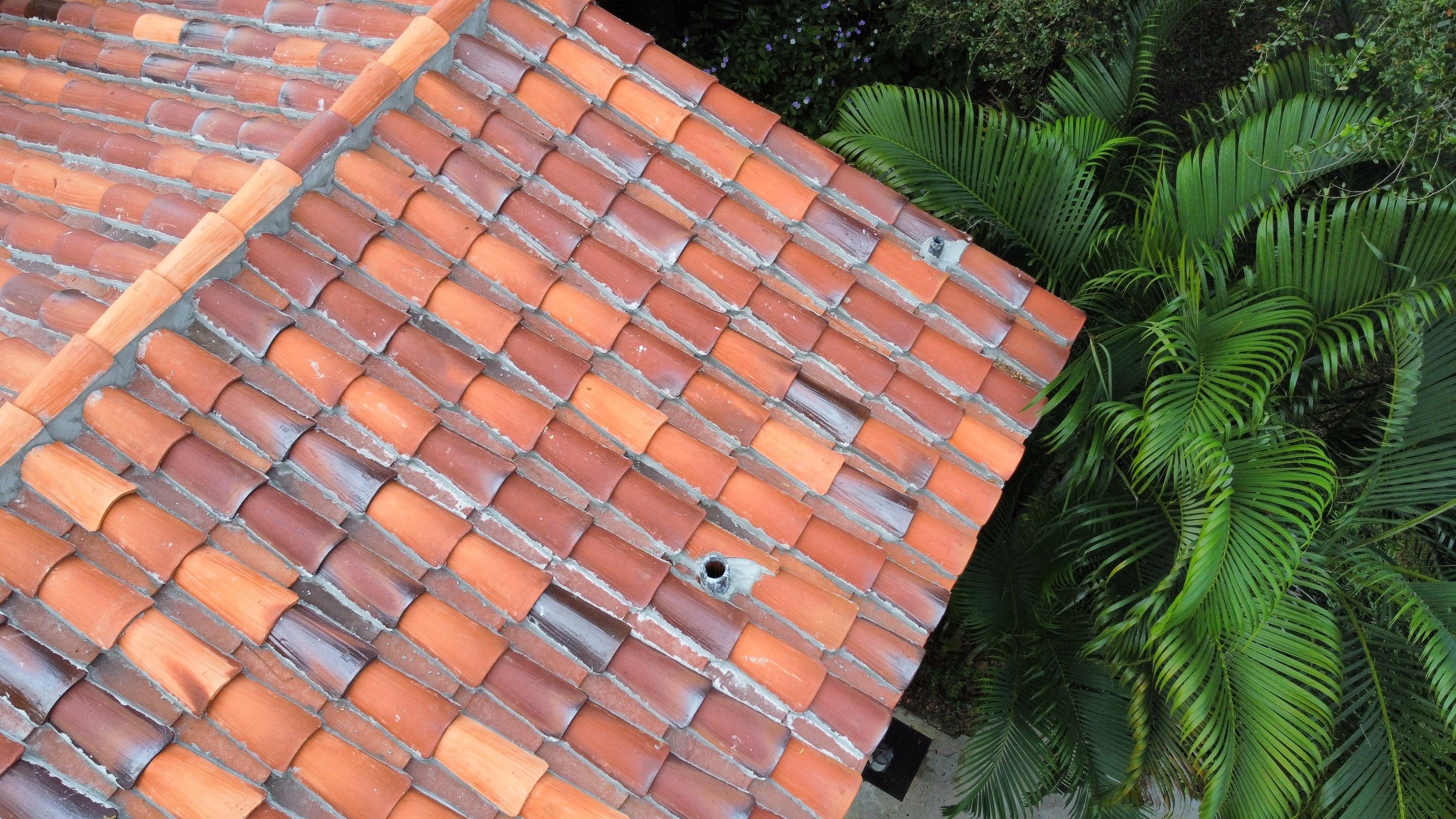 Residential Roofing Installation using Two Piece Clay Barrel Tile with a mortar set application by BOB HILSON & CO INC