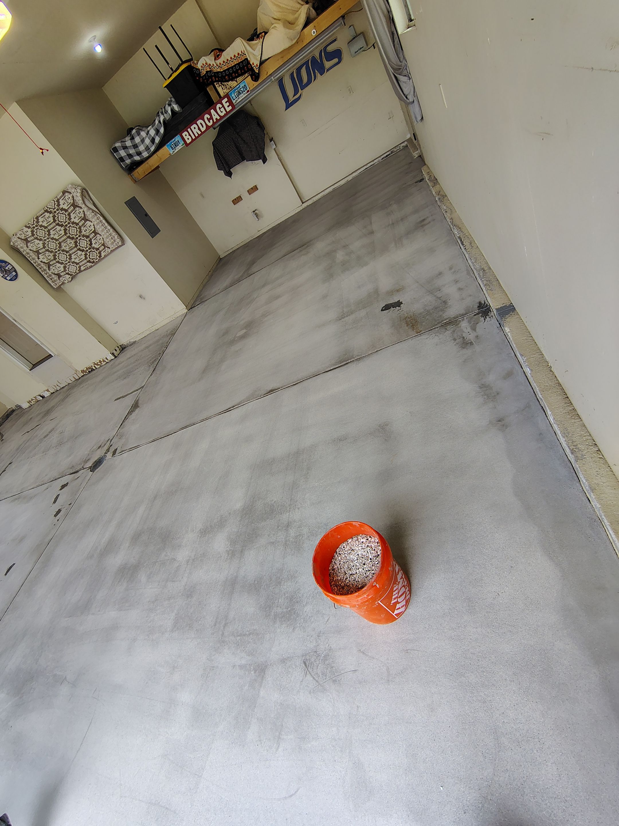 Sioux Falls Garage Floor Repair and Speckled Epoxy Coating Installation by Select Painting, Coatings & Garage Cabinets
