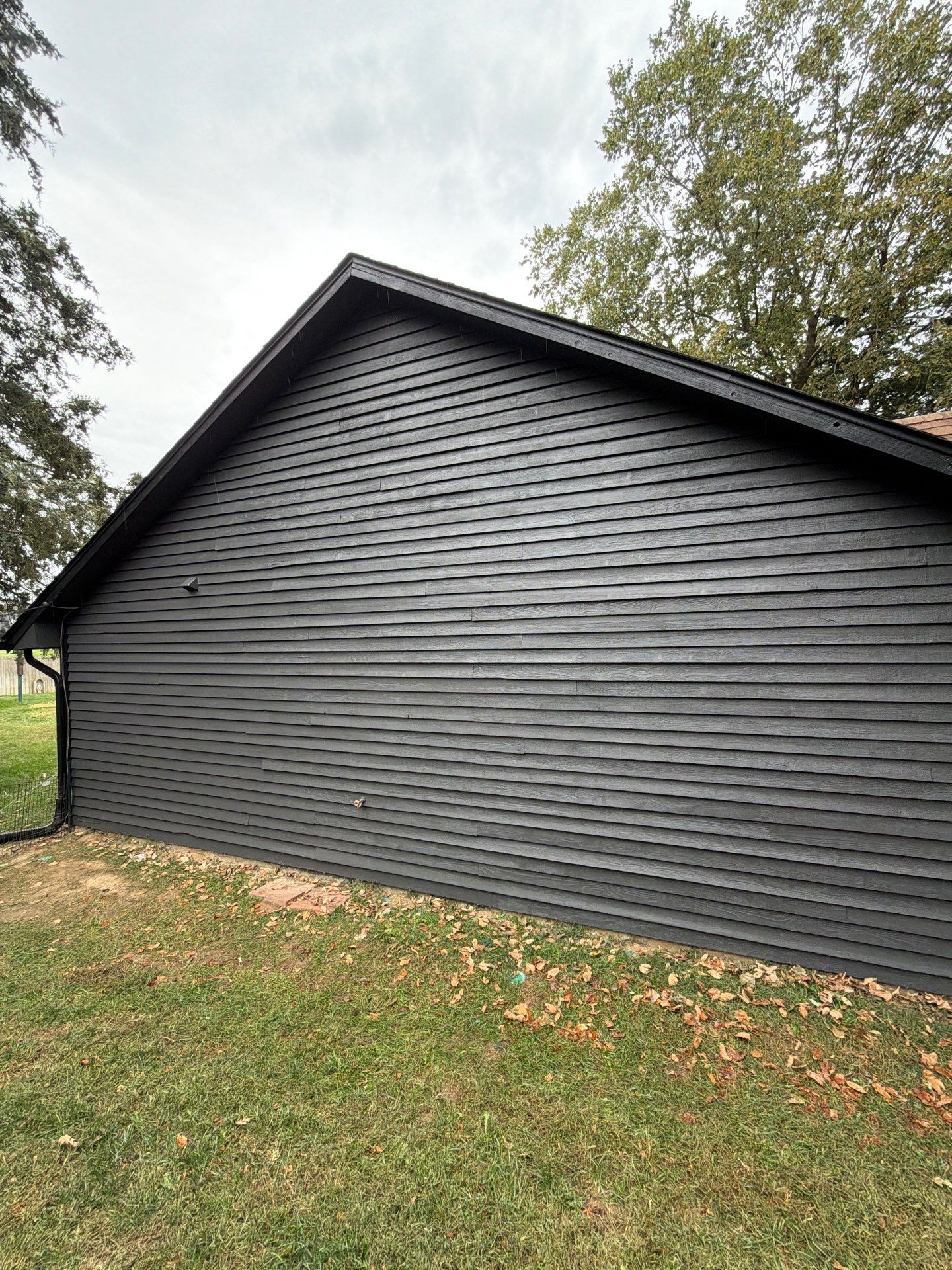 Wood siding refresh by Pezley Painting