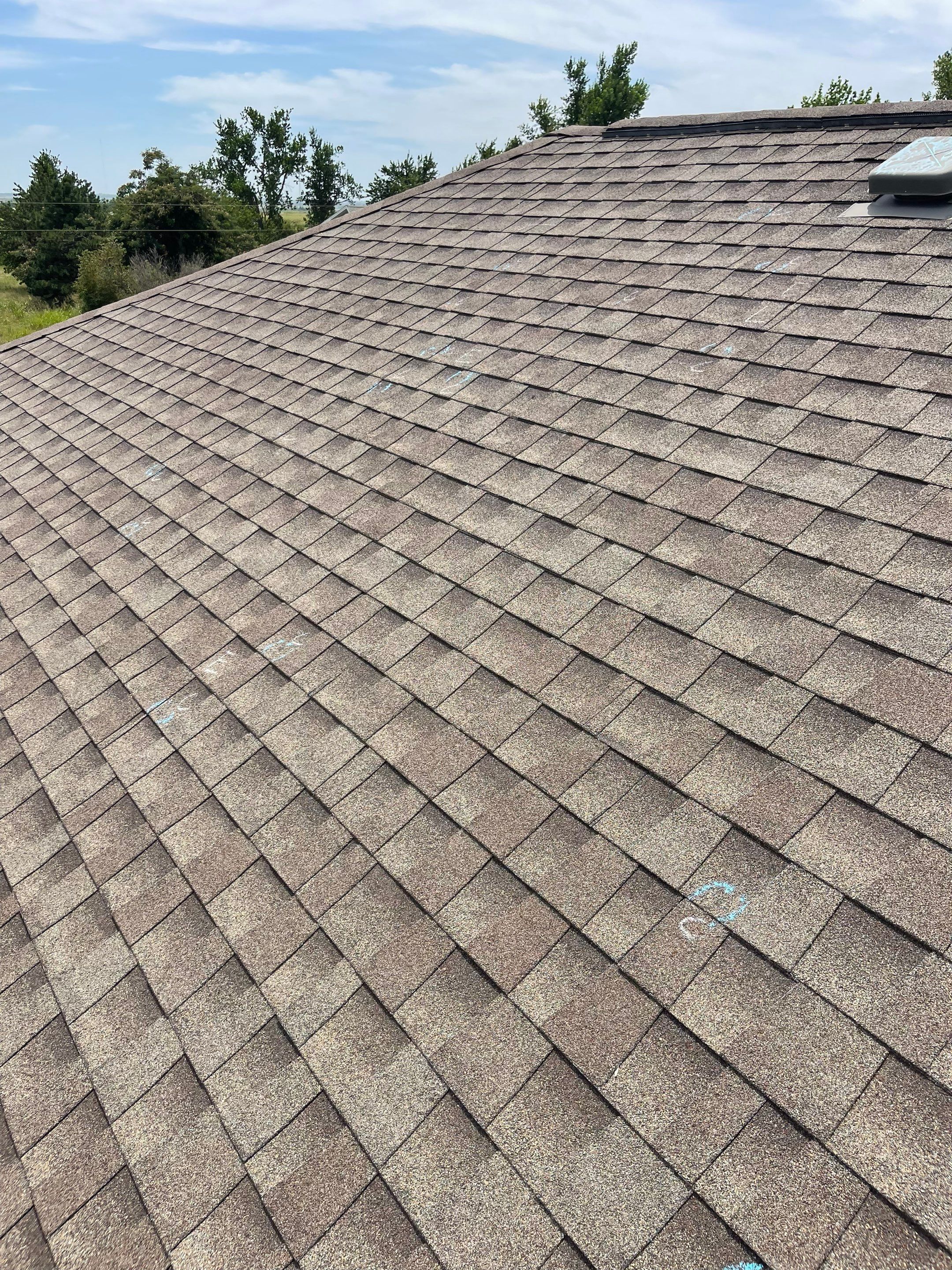 Hail Damage on a Roofing System by Icon Roofing And Construction 