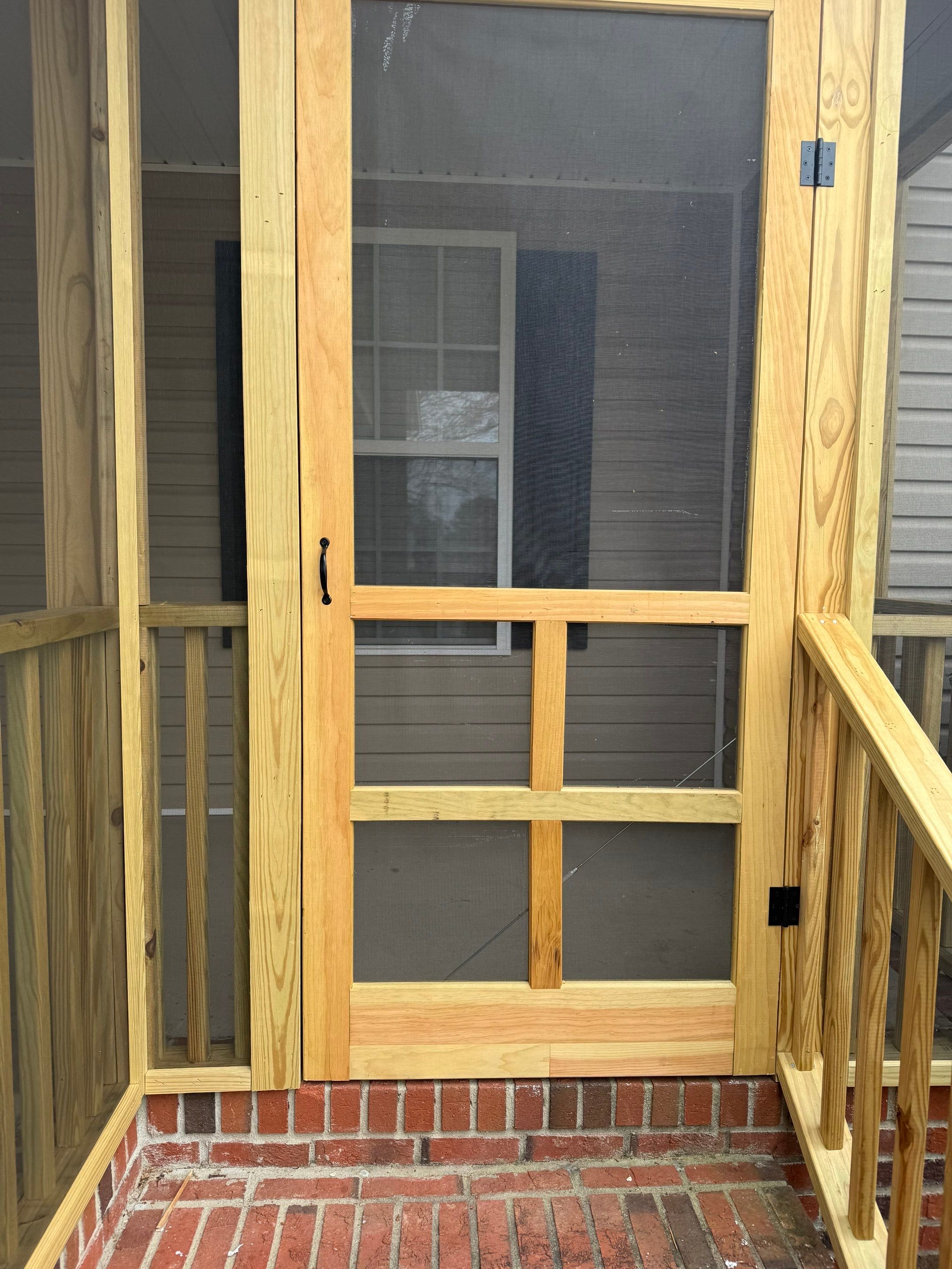 Custom Screened Porch Conversion with New Wood Railing in Dunn by The Remodeling Company