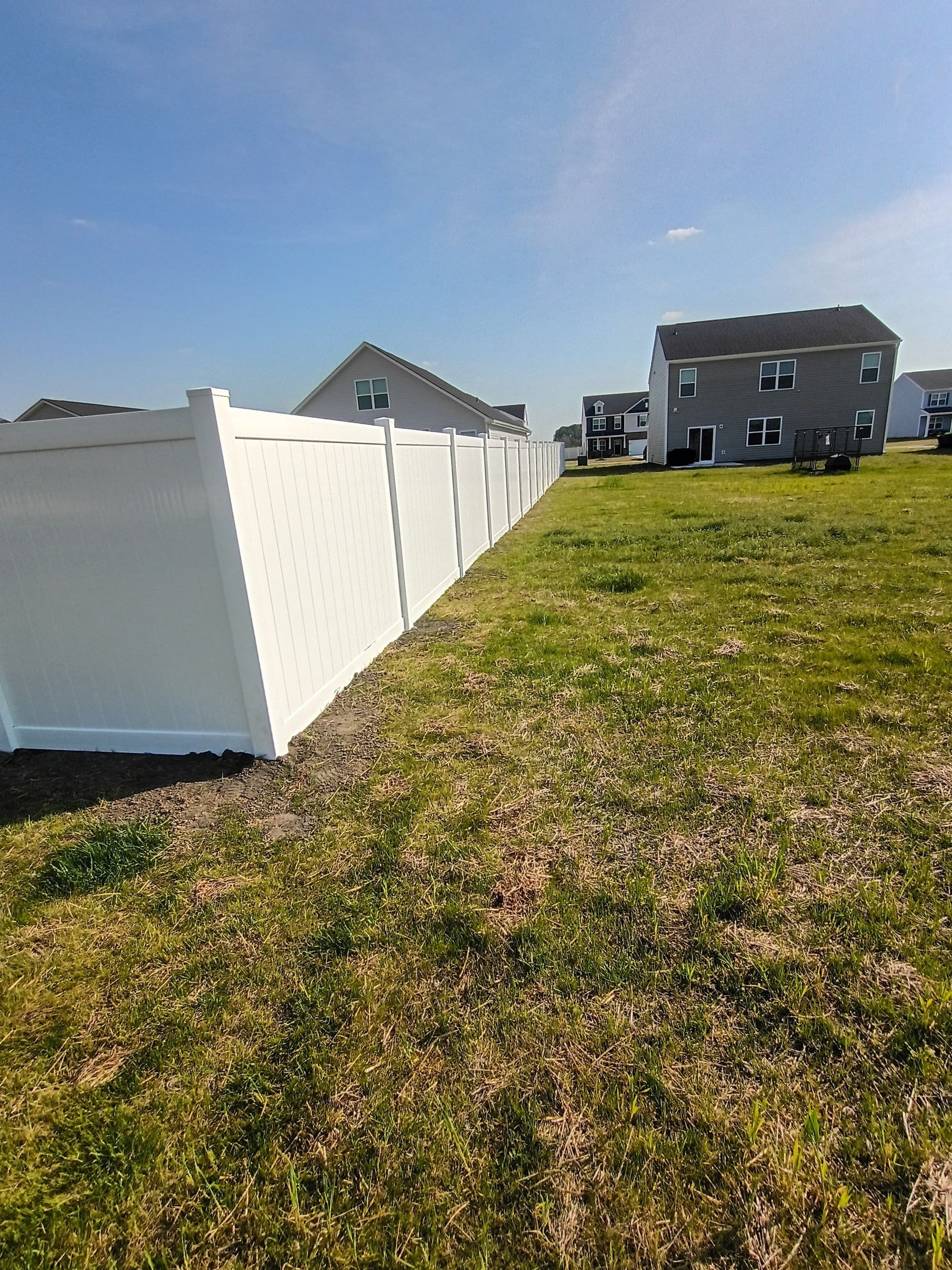 White Vinyl Privacy Fence Installation in Ayden, North Carolina by Superior Fence and Rail