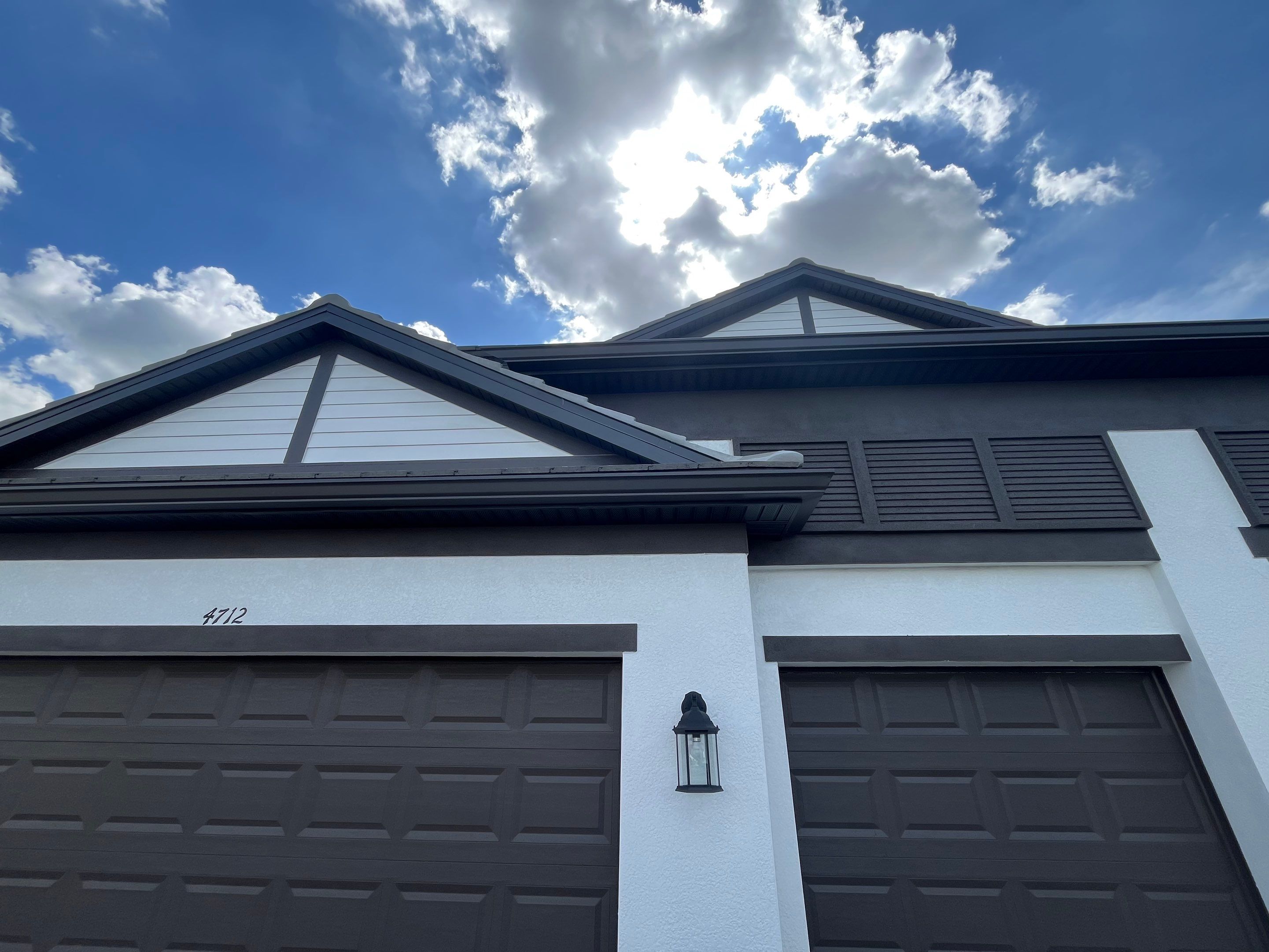 Modern Black Bronze Seamless Gutters for a Stylish Home by Gutter Professors