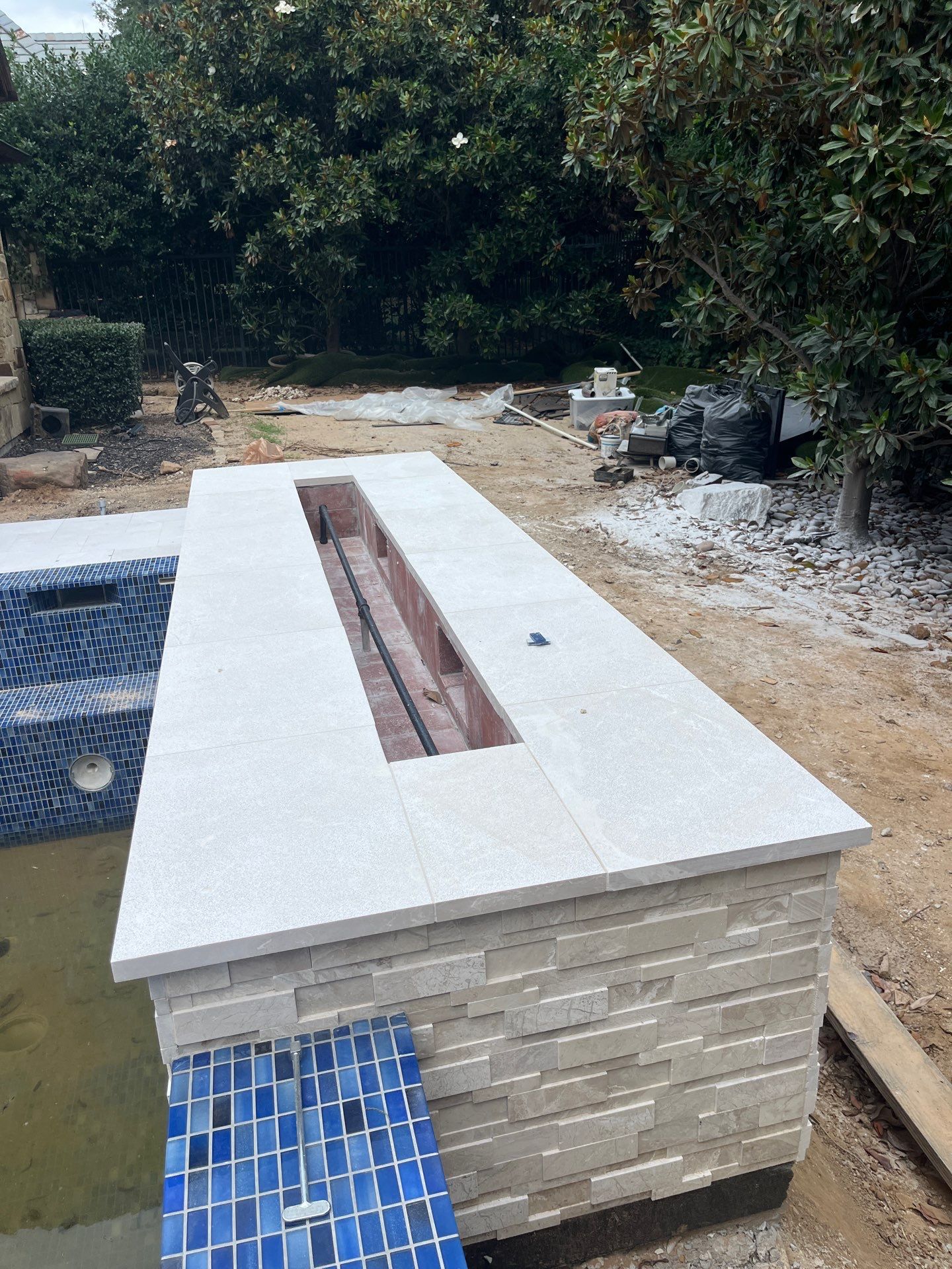 Geometric Pool with Raised Spa and Blue Tile by Pinnacle Pools and Spas - DFW