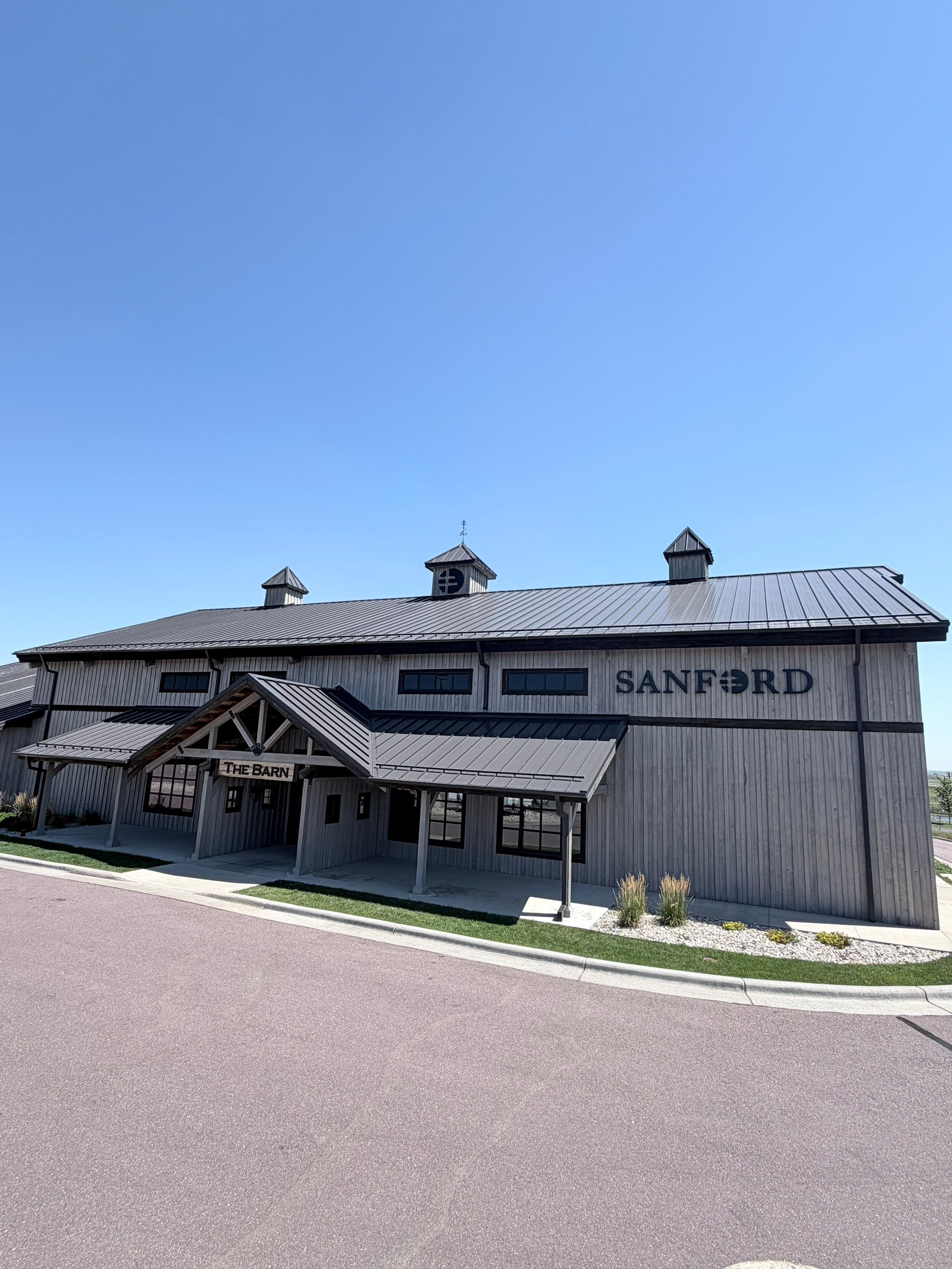 Commercial Exterior Wood Staining for Sanford Barn in Sioux Falls by Select Painting, Coatings & Garage Cabinets