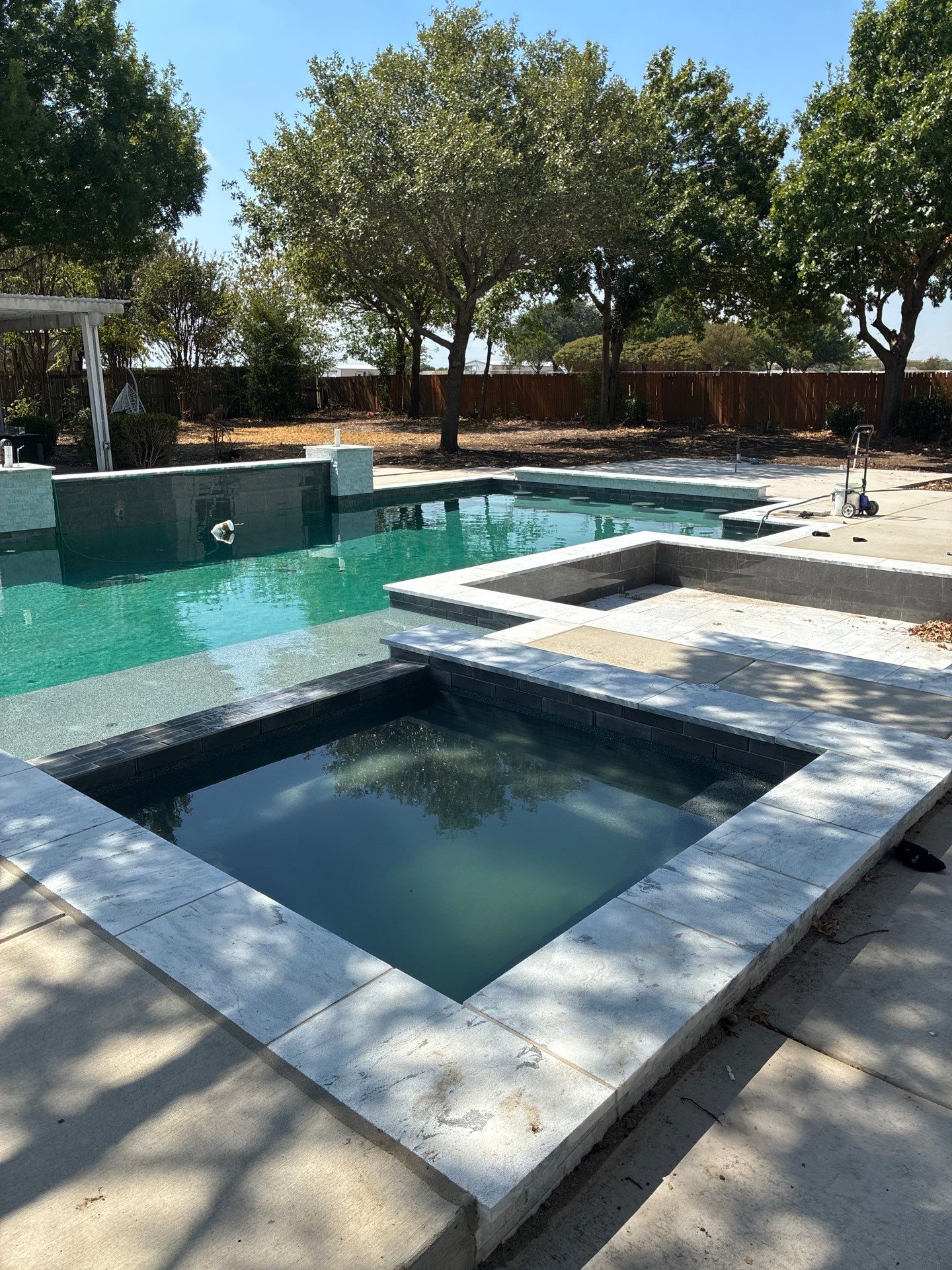Modern Geometric Pool with Raised Spa and Sun Ledge by Pinnacle Pools and Spas - DFW