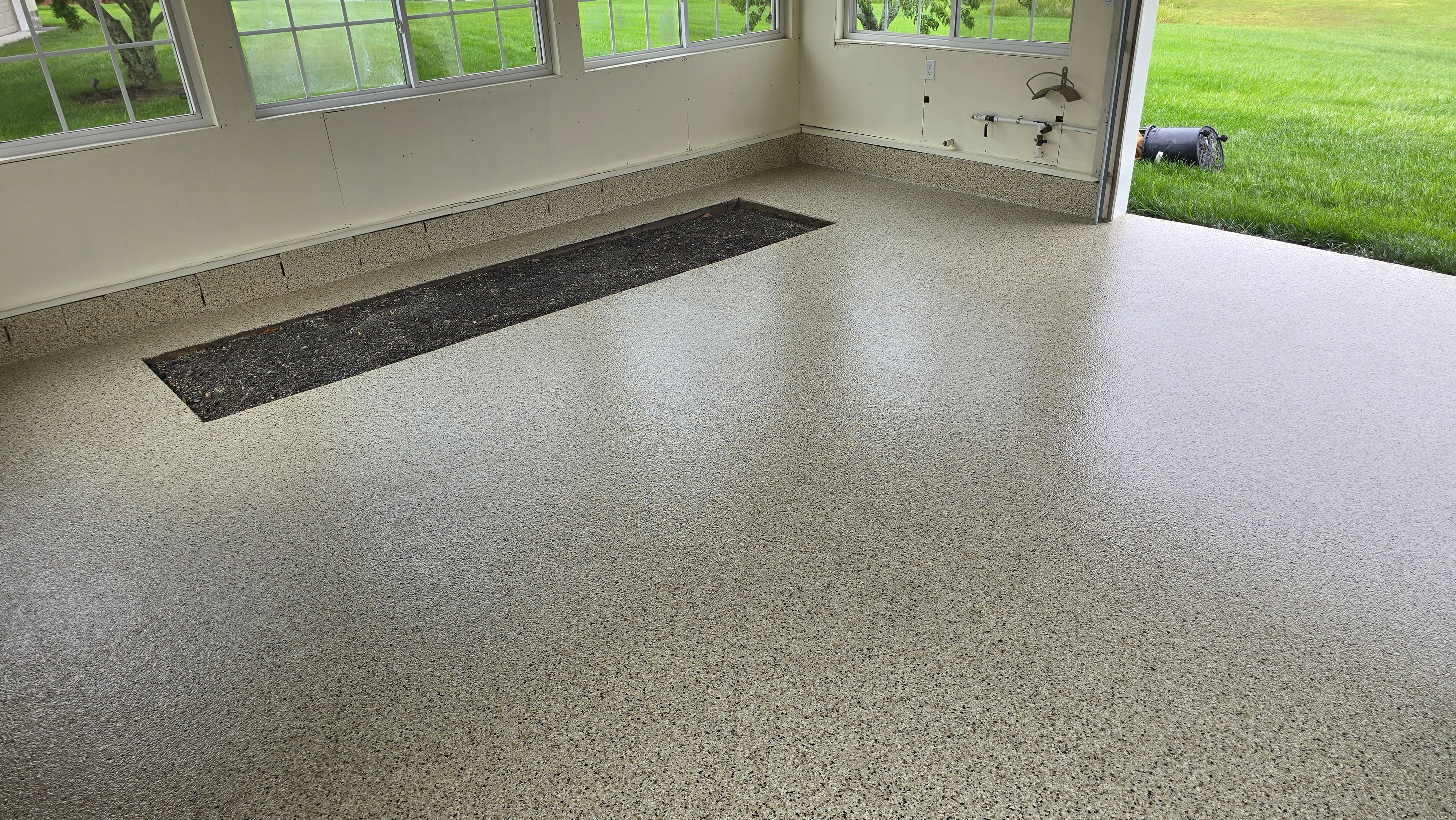 Two garages completed using Shoreline and Midnight by Elite Floor Solutions