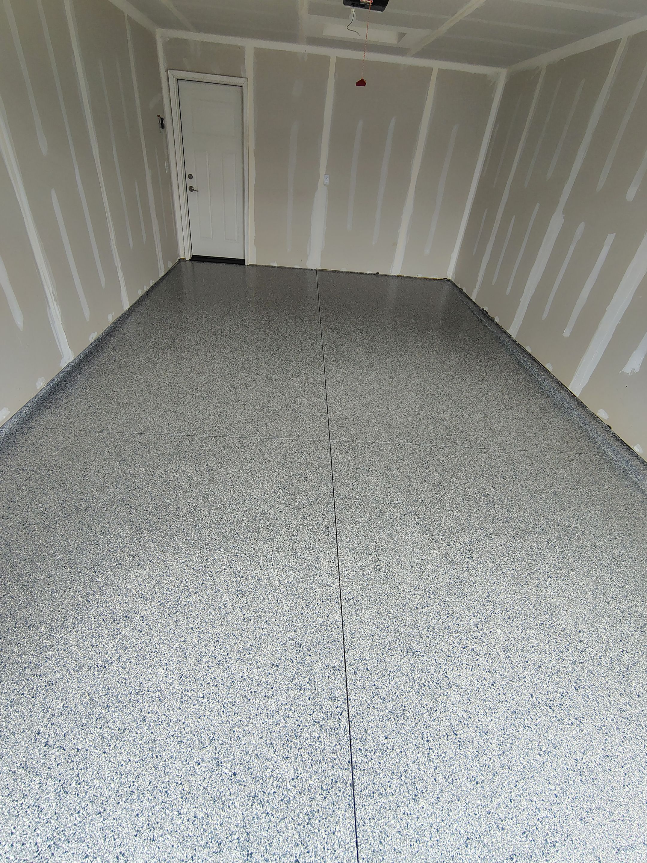 Custom Epoxy Garage Floor Coating Installation in Sioux Falls by Select Painting, Coatings & Garage Cabinets