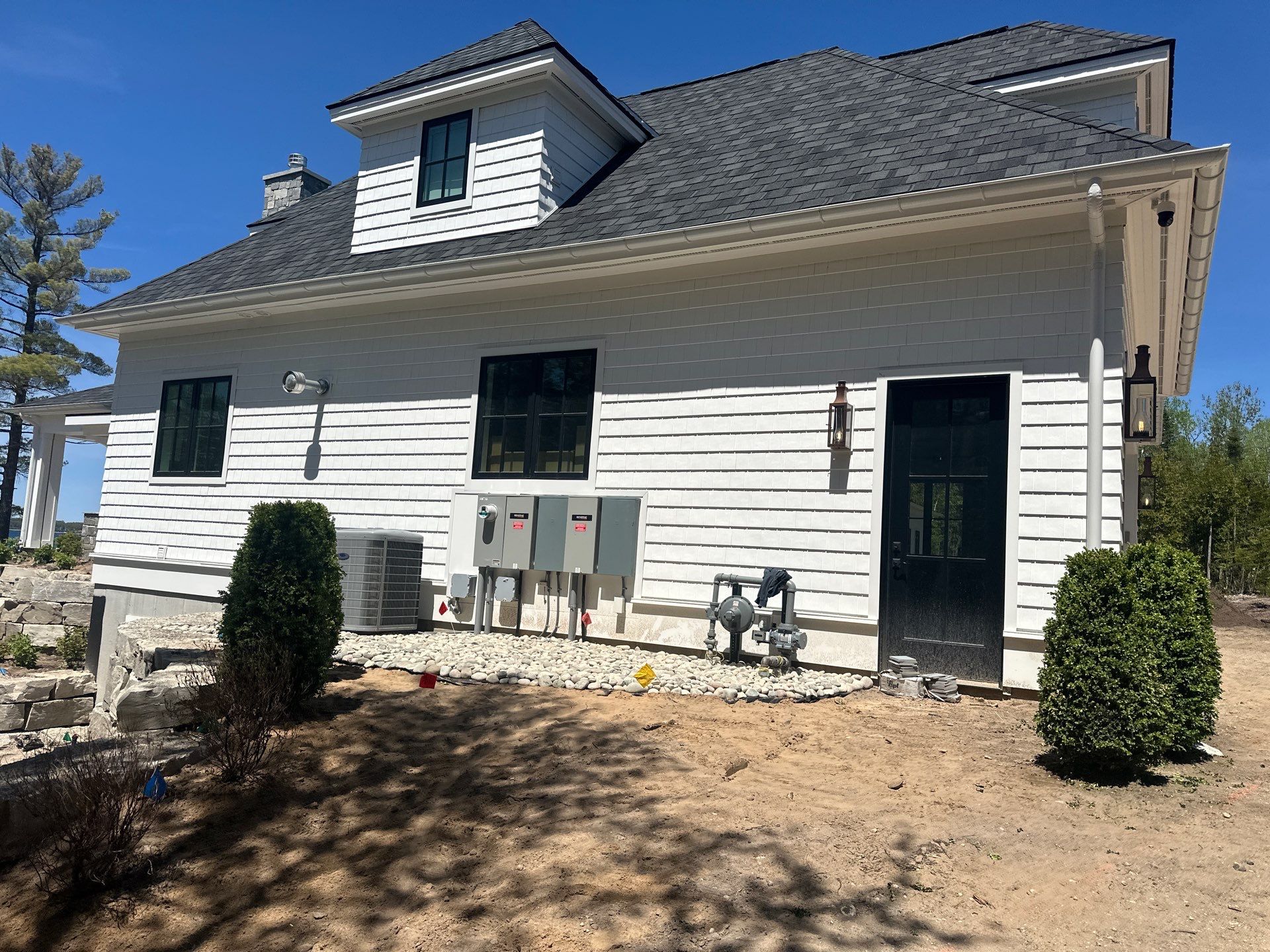 Gutter System and Exterior Drainage Installation in Charlevoix by Rainbow Seamless Systems