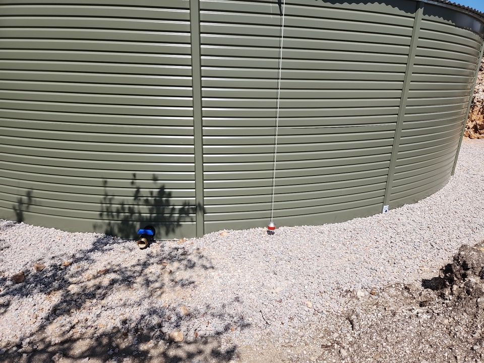 Residential Rainwater Collection System - Pioneer 40K gallon water tank in Mangrove Green by Hill Country Rain Water