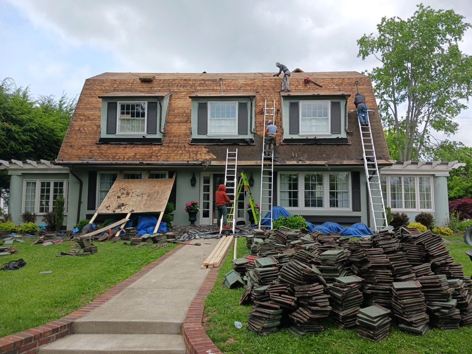 Slate removal/Cedar Shake replacement by Storm Contracting 