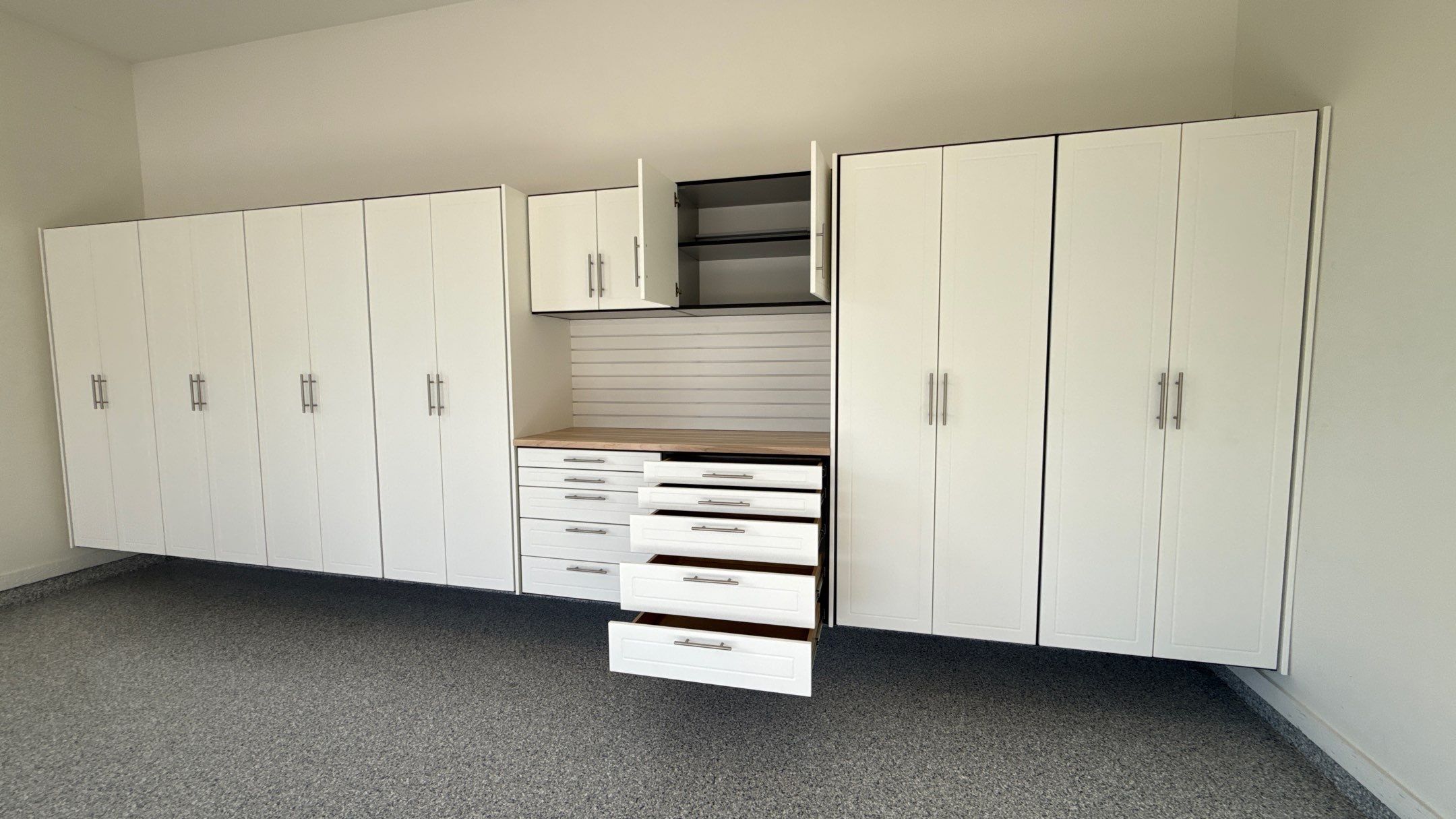 Garage Remodel with Custom Cabinets and Epoxy Floors in Overland Park by Banner Garage