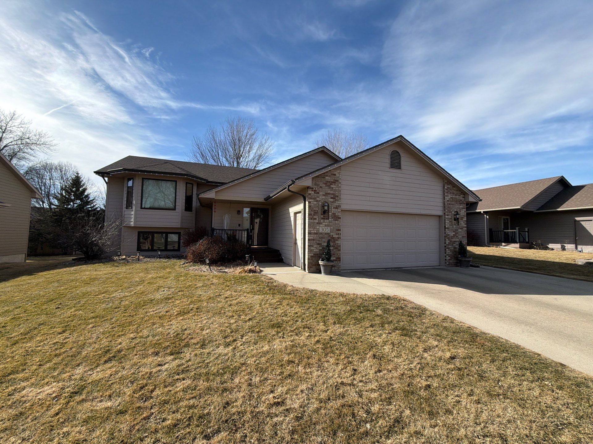 Residential Exterior Painting and Trim Restoration in Sioux Falls by Select Painting, Coatings & Garage Cabinets