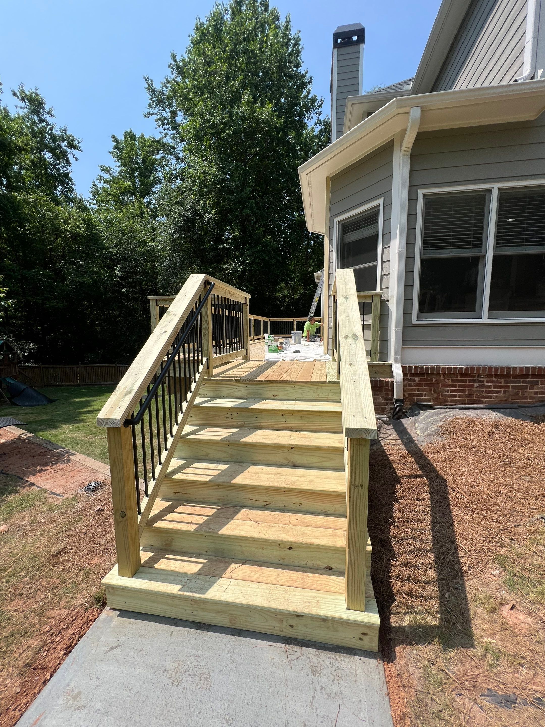 Elevated Wood Deck Replacement and Staircase Installation in Woodstock by Swift Home Renovations
