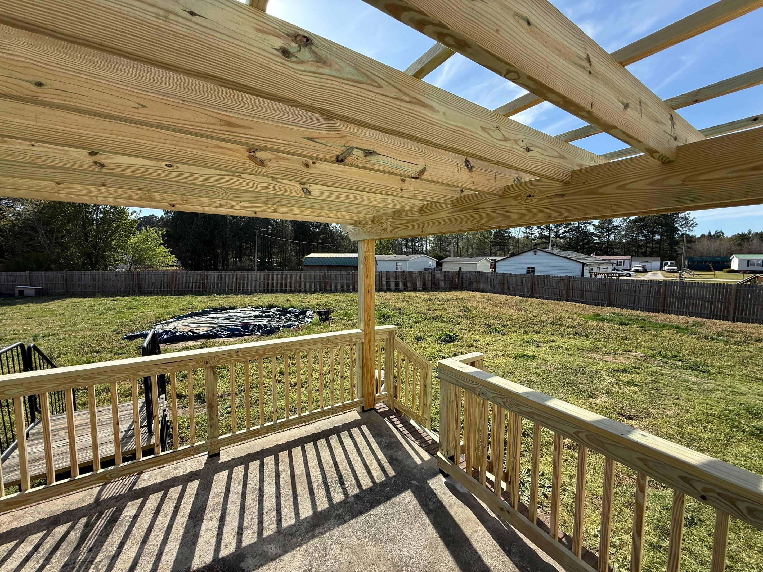 Custom Wooden Pergola and Deck Installation in La Grange, NC by The Remodeling Company