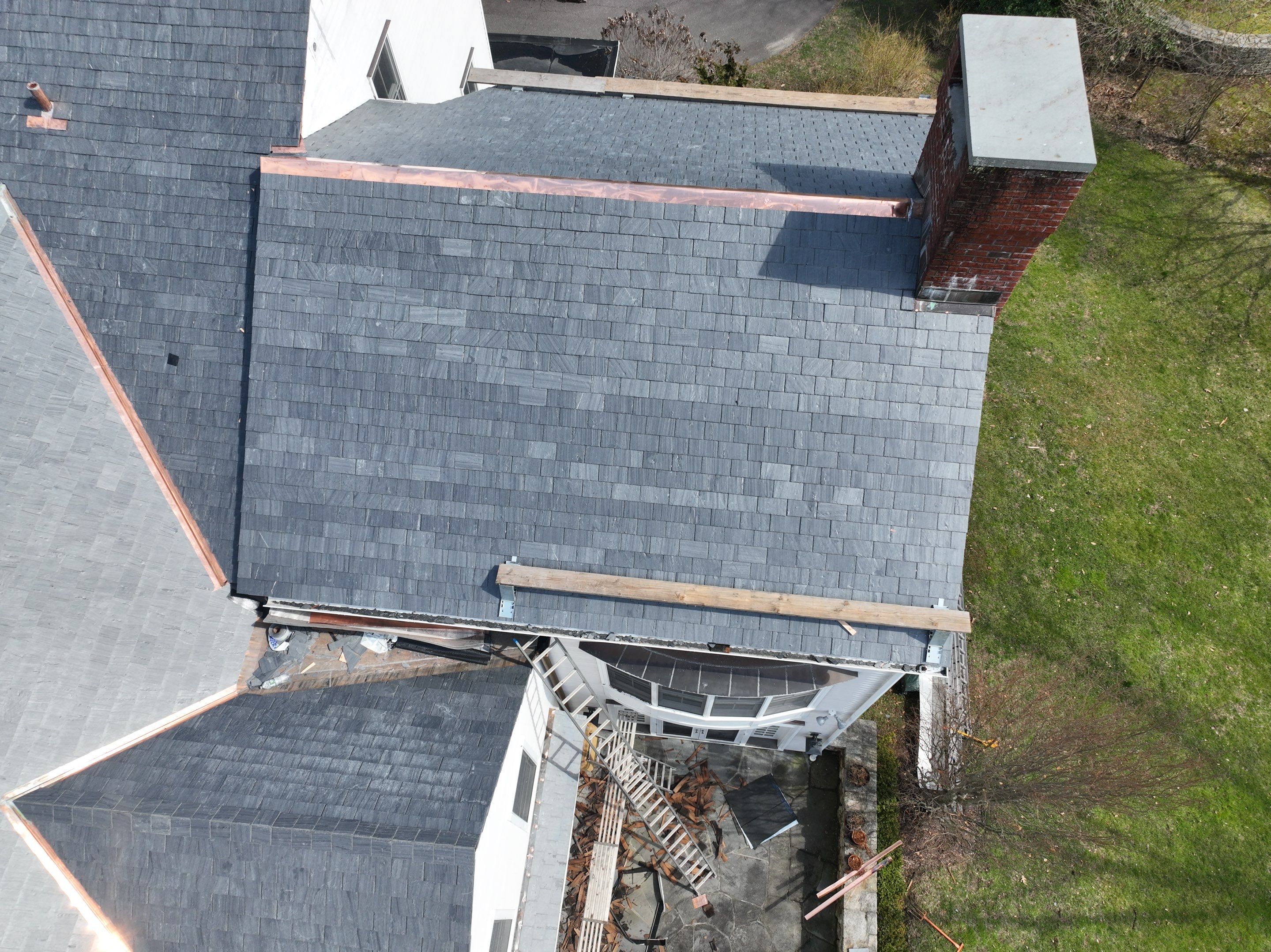 Residential Roofing Installation using Vermont Slate by A Plus Exterior