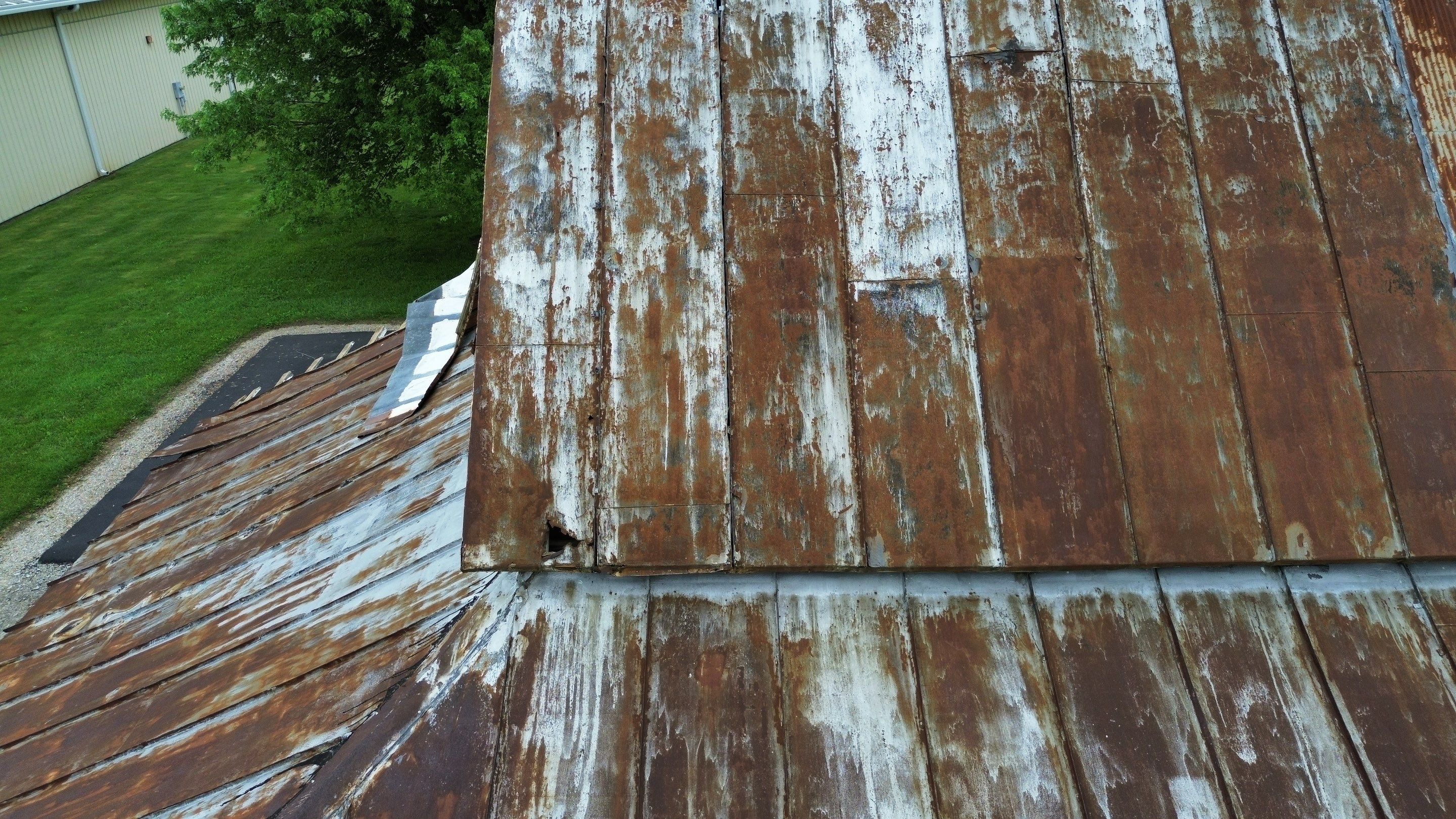 Residential Roofing Installation using Standing Seam Metal - Barn Red by RoofX 