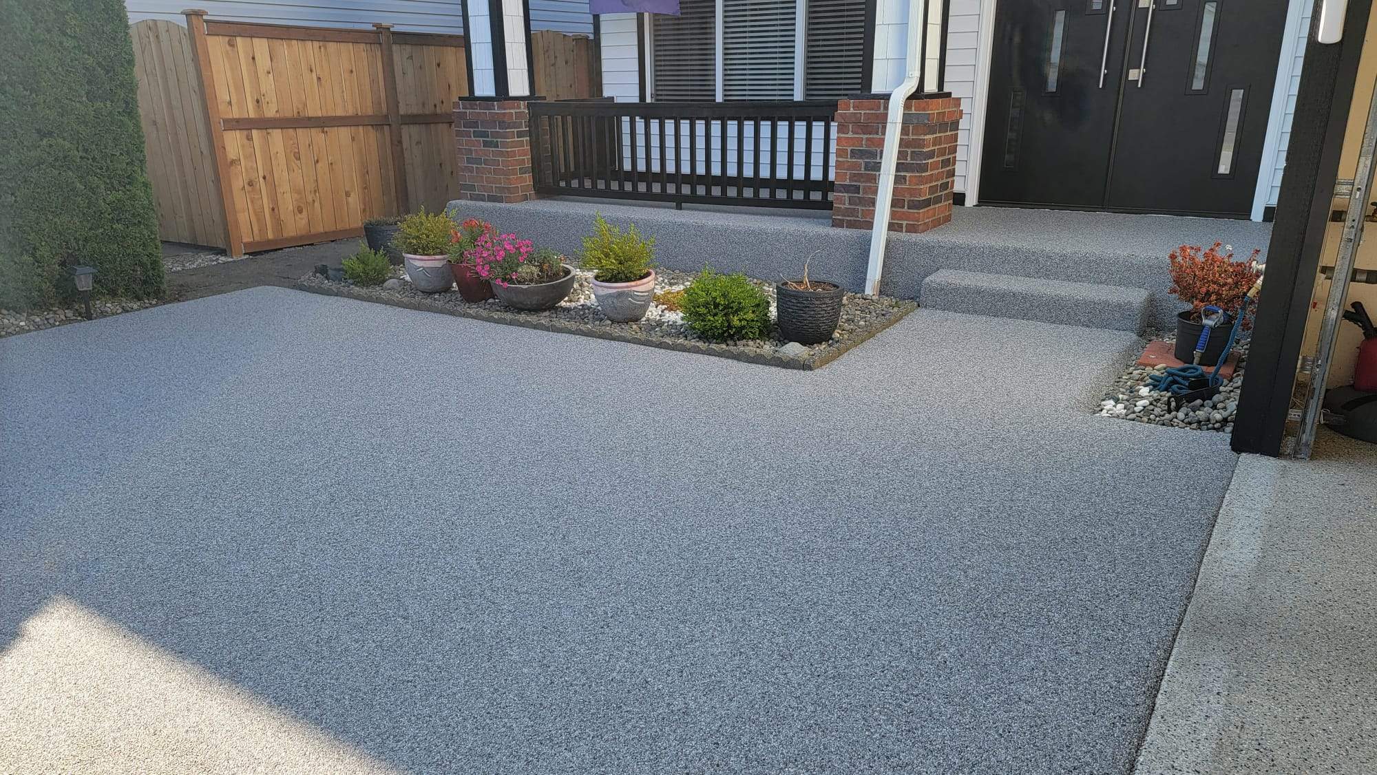 Poseidon Patio and Driveway by Concrete Coating Experts Inc.