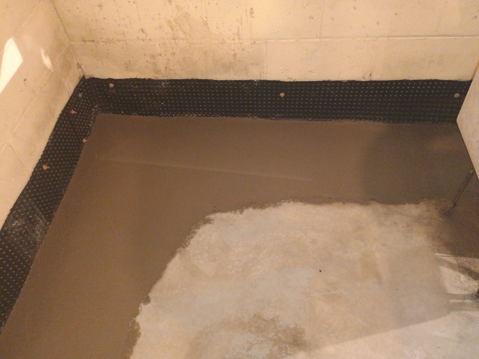 Drain Tile & Sump Pump for Kassie's Rental Property by Waterproofing Northeast