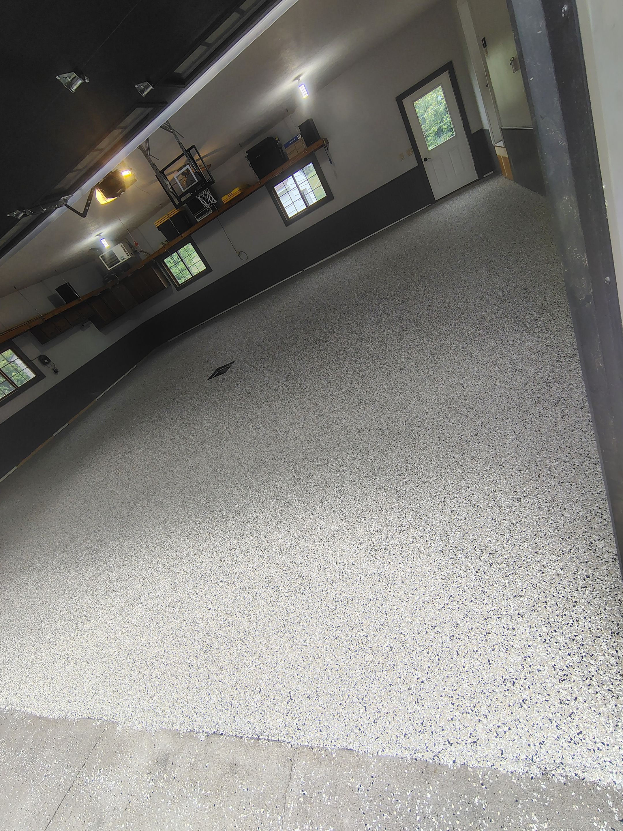 Multi-Fleck Epoxy Garage Floor Coating in Dell Rapids by Select Painting, Coatings & Garage Cabinets