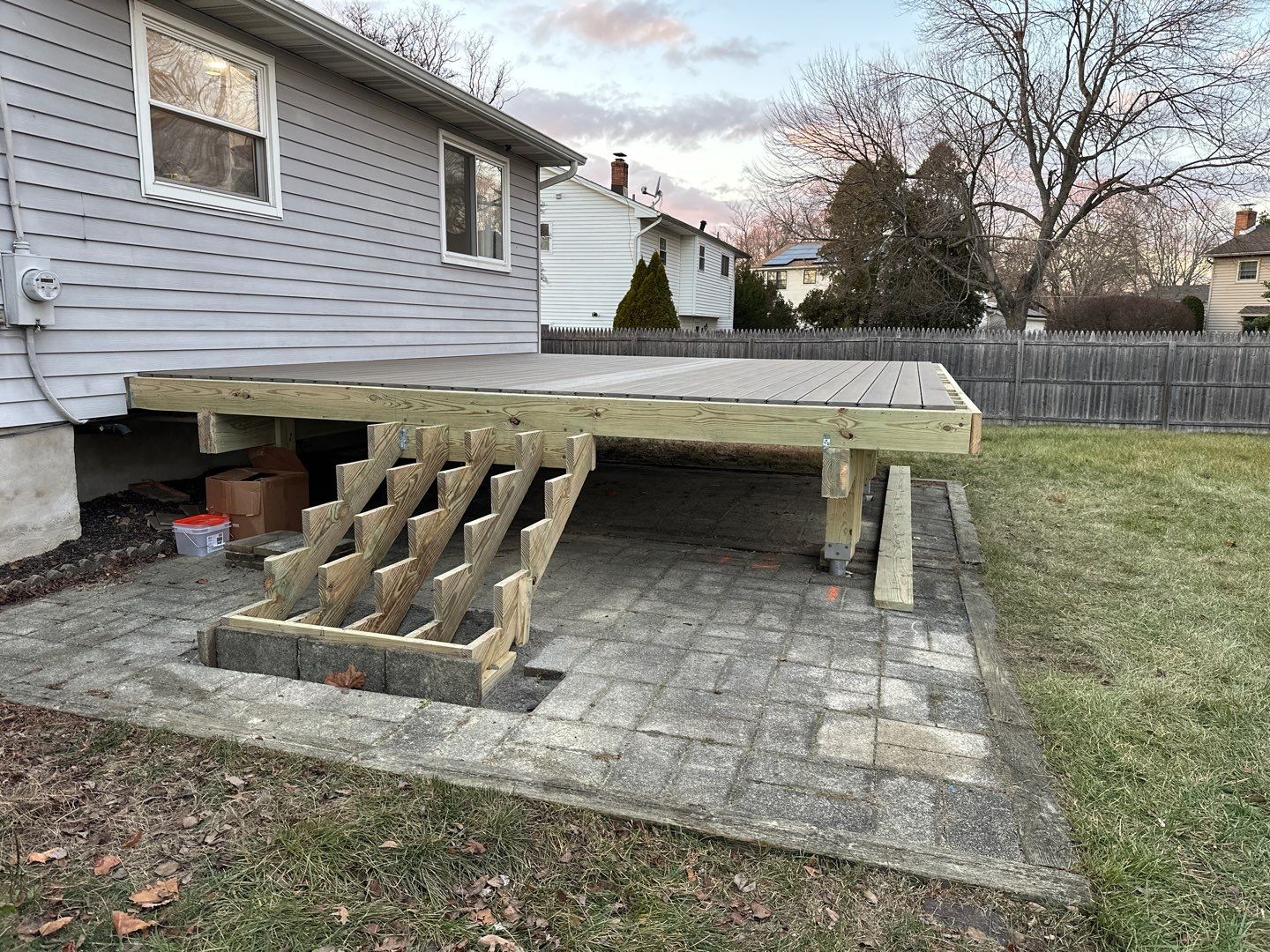 New deck construction and replacement of window with new sliding door  by deck guardian