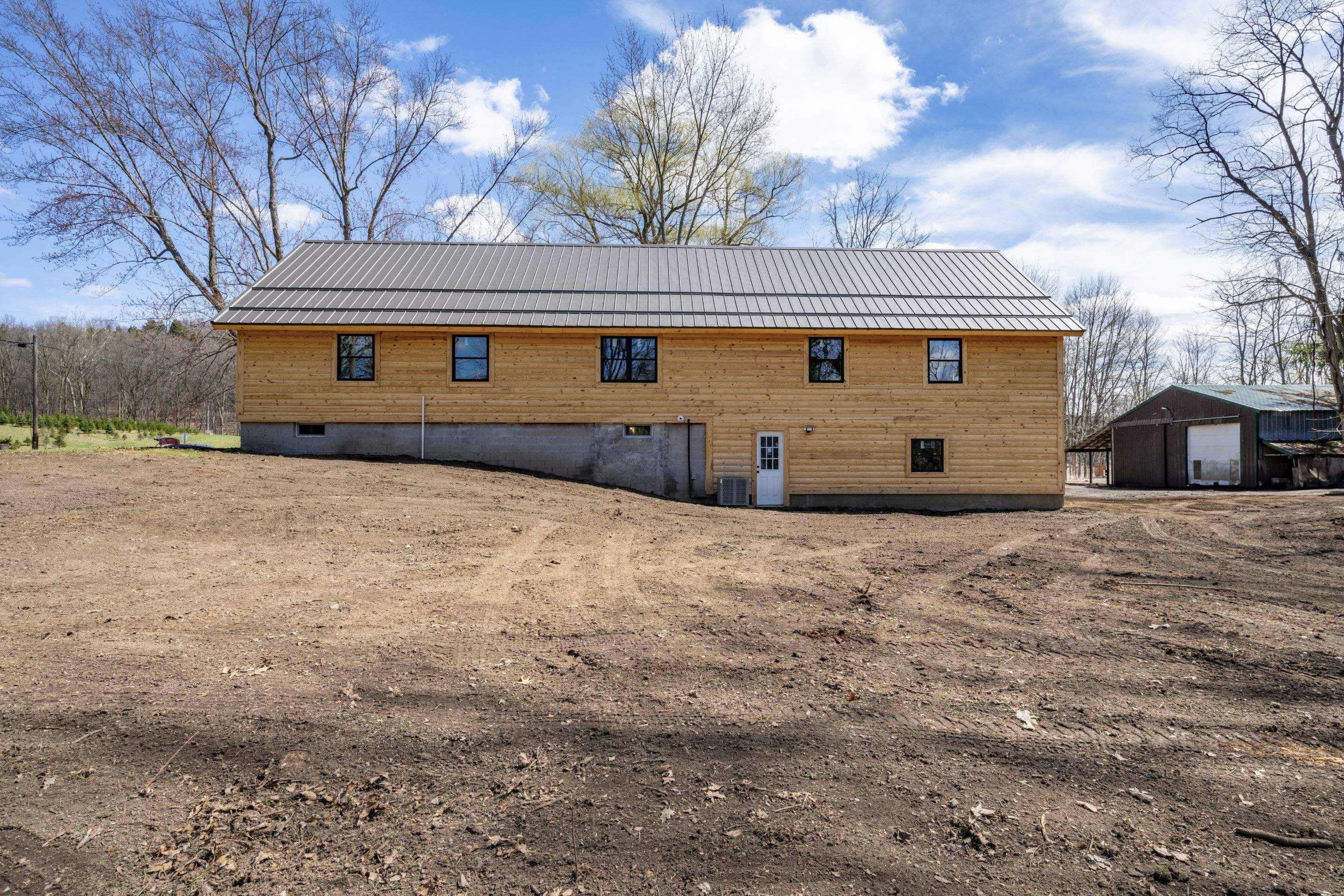 New Addition to Home using Log Cabin Siding  by Horst Custom Homes 