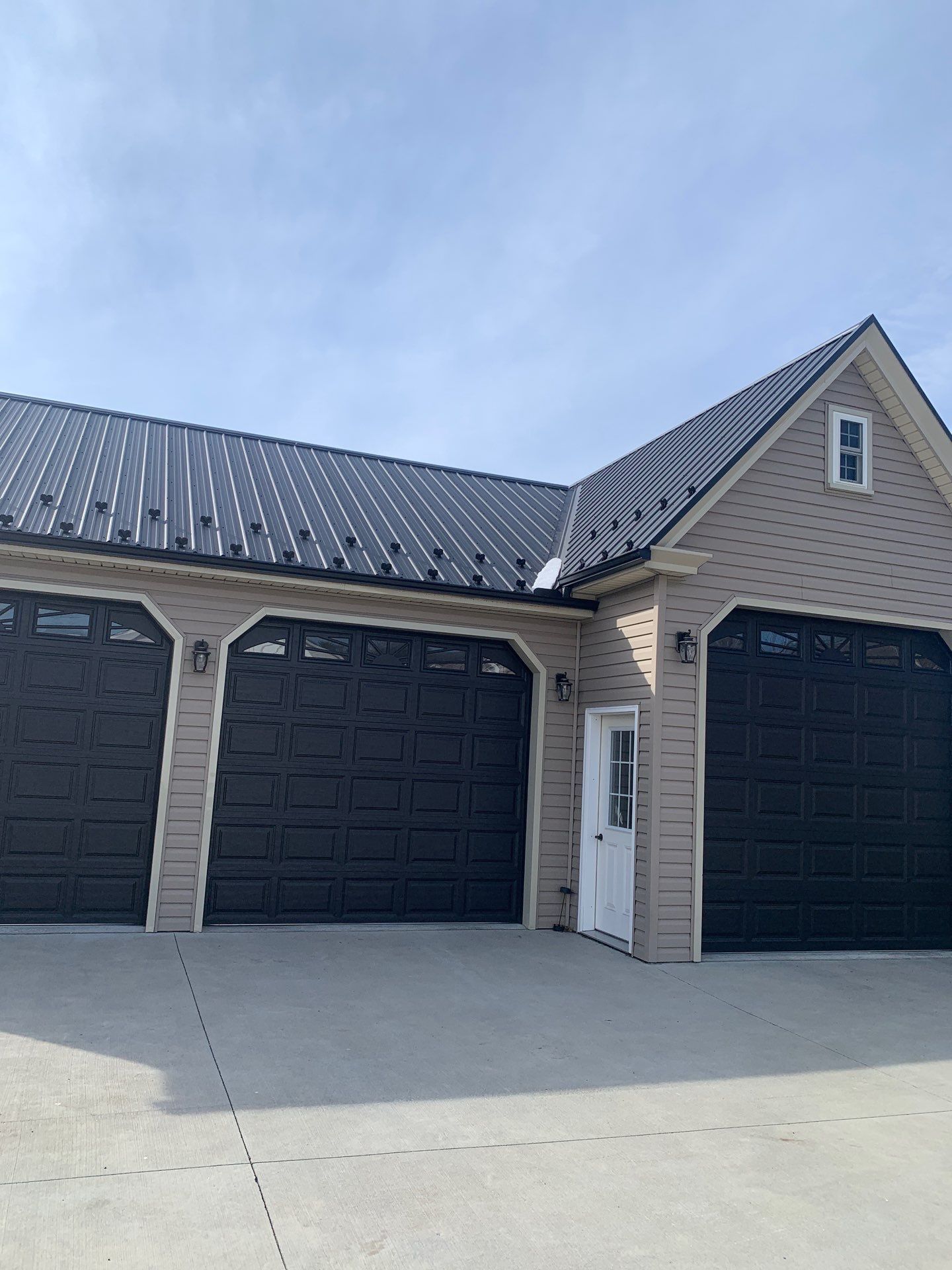 Textured Black Meal Roof by Esh Builders