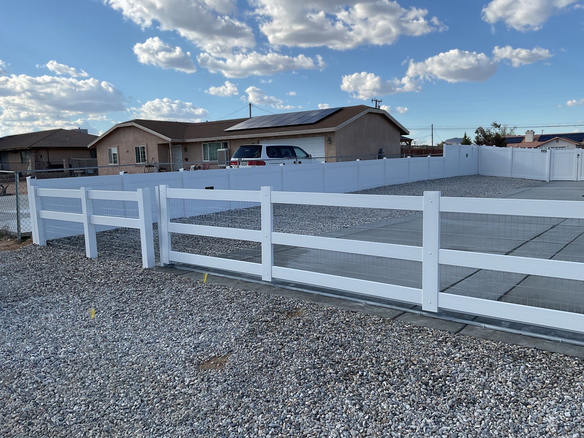 Wrought Iron Frame Ranch Style Sliding Gates by Fence Guys Inc.