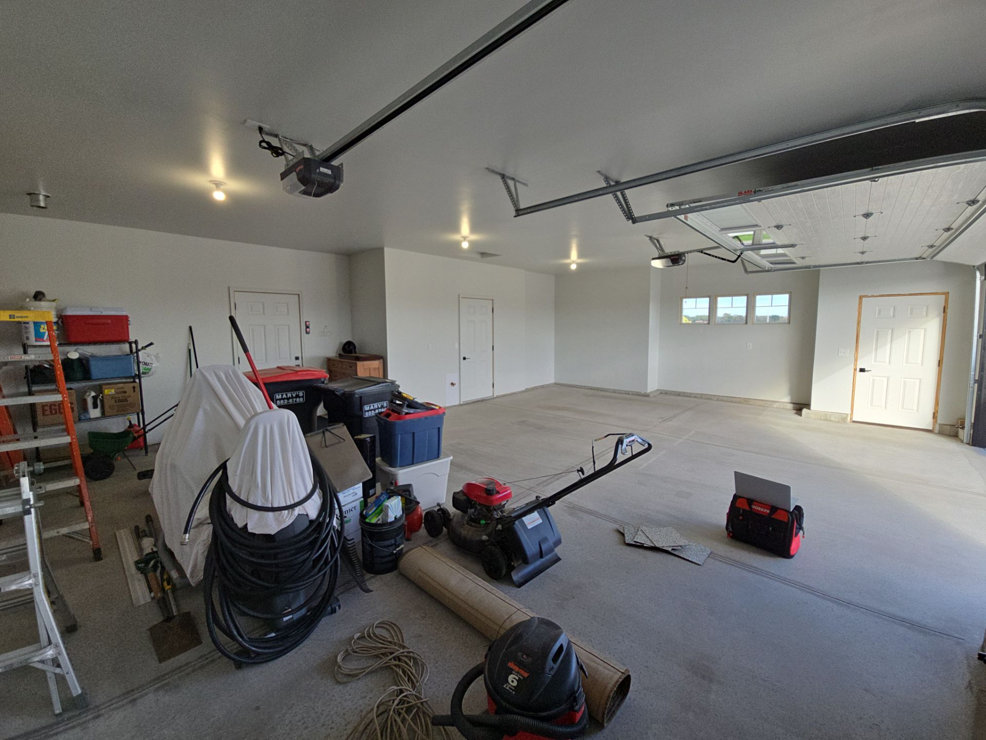 High-Gloss Epoxy Flake Garage Floor Coating in Brandon by Select Painting, Coatings & Garage Cabinets