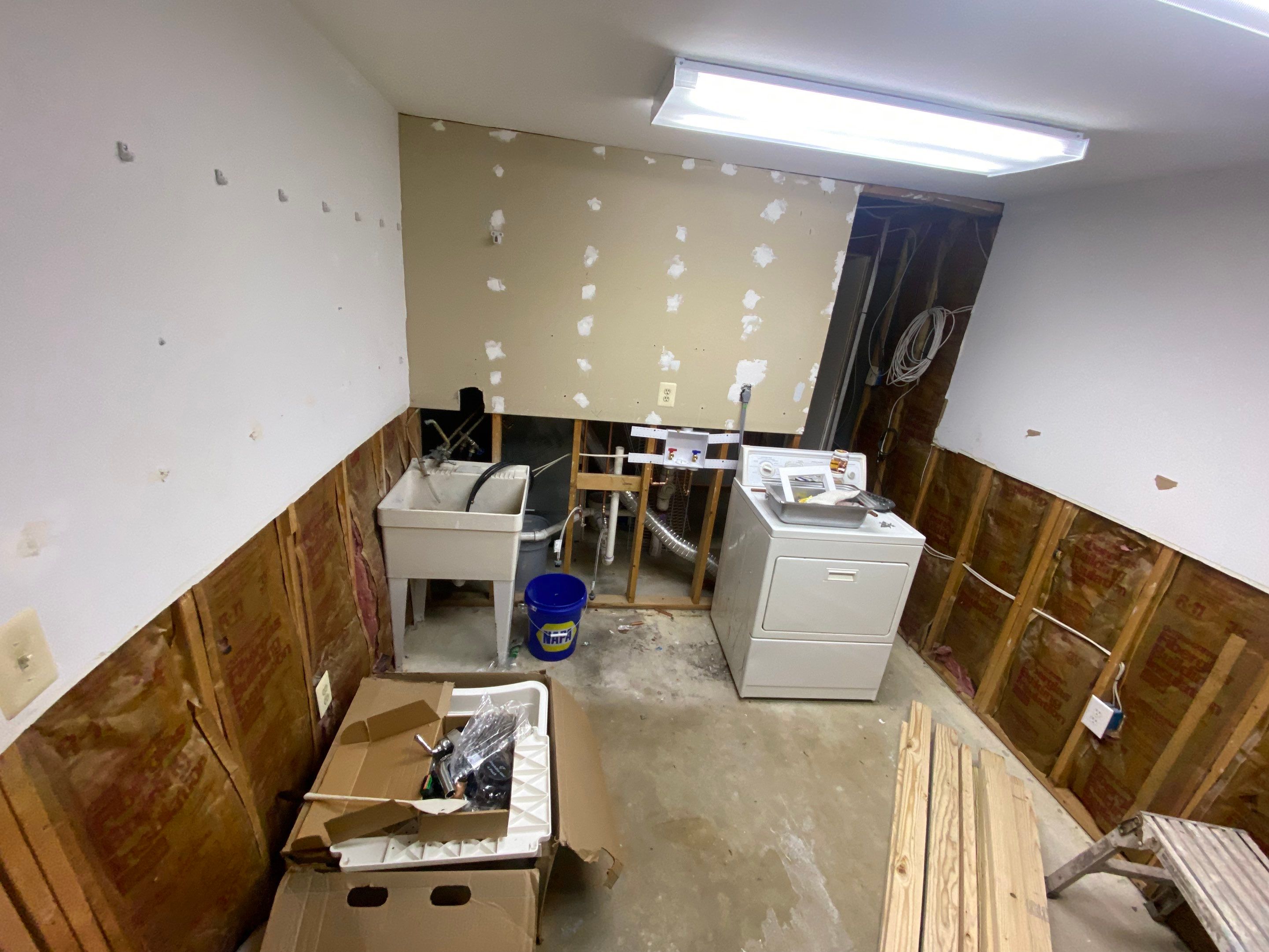 Laundry Room Redmodel using Lifeproof Luxury Vinyl Plank Flooring by The Smet Companies, LLC