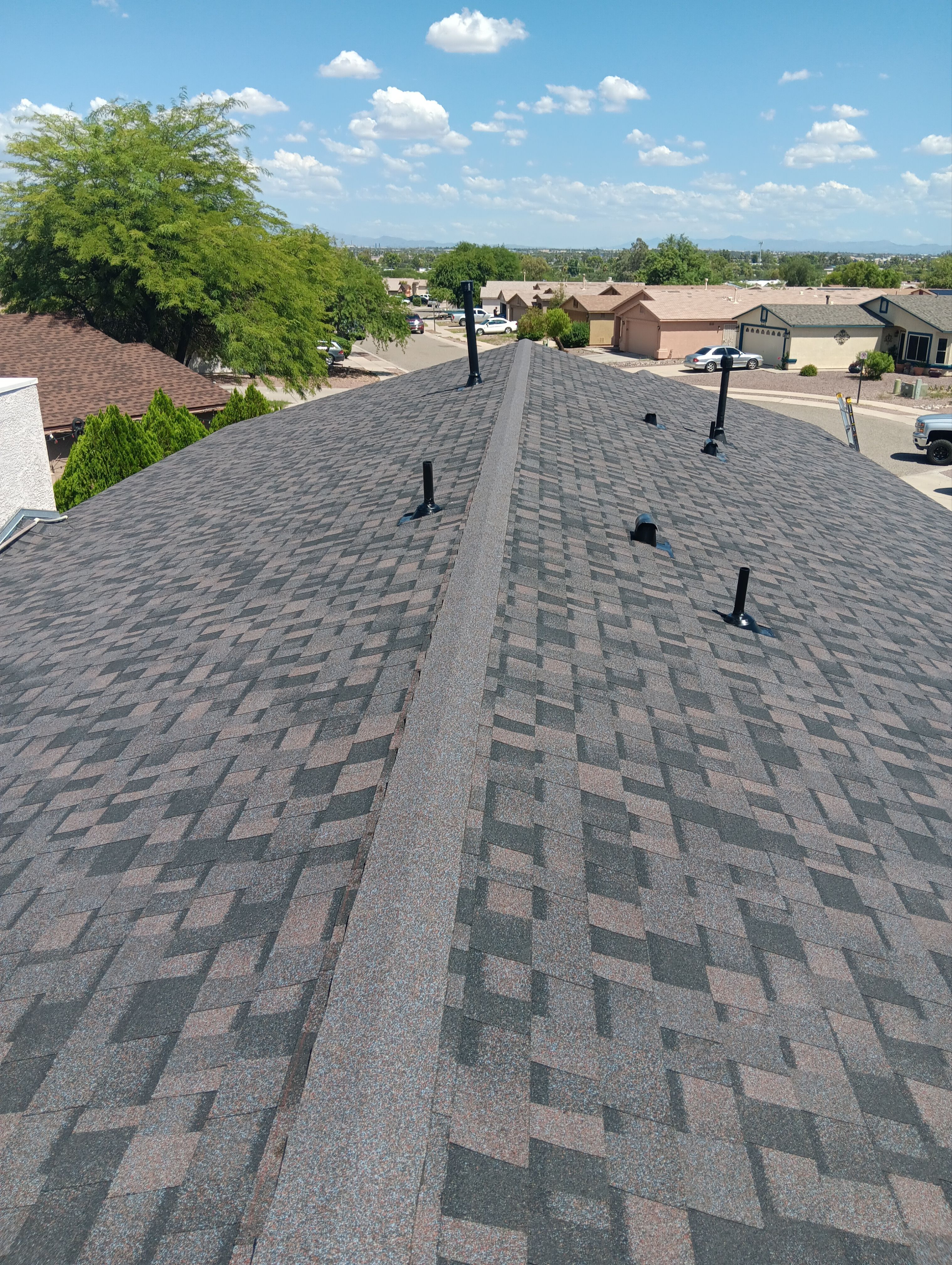 Charcoal Shingles by Reimagine Roofing