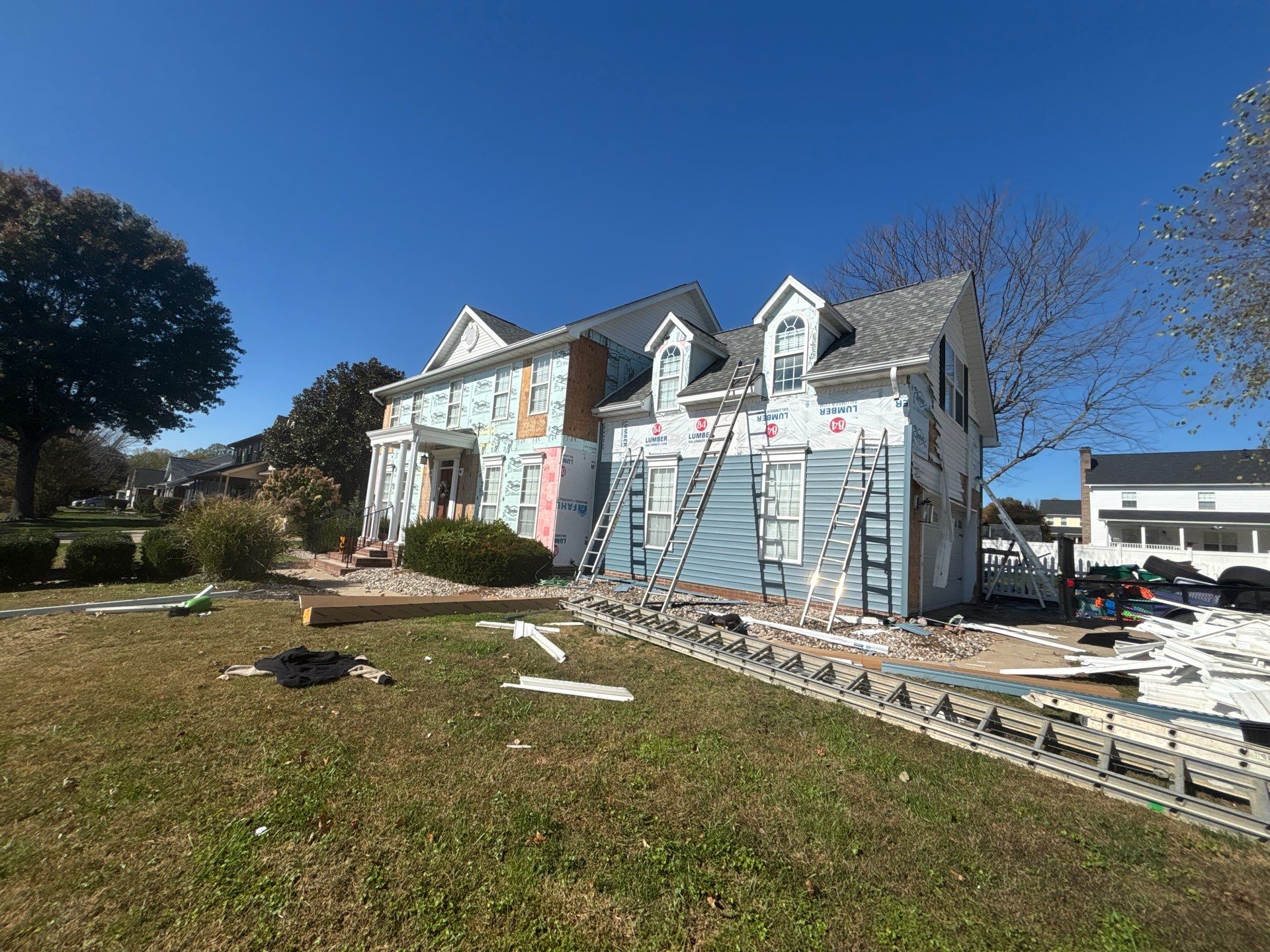 Landmark Pro, Siding, and 6" Gutters by Fahey Roofing + Contracting