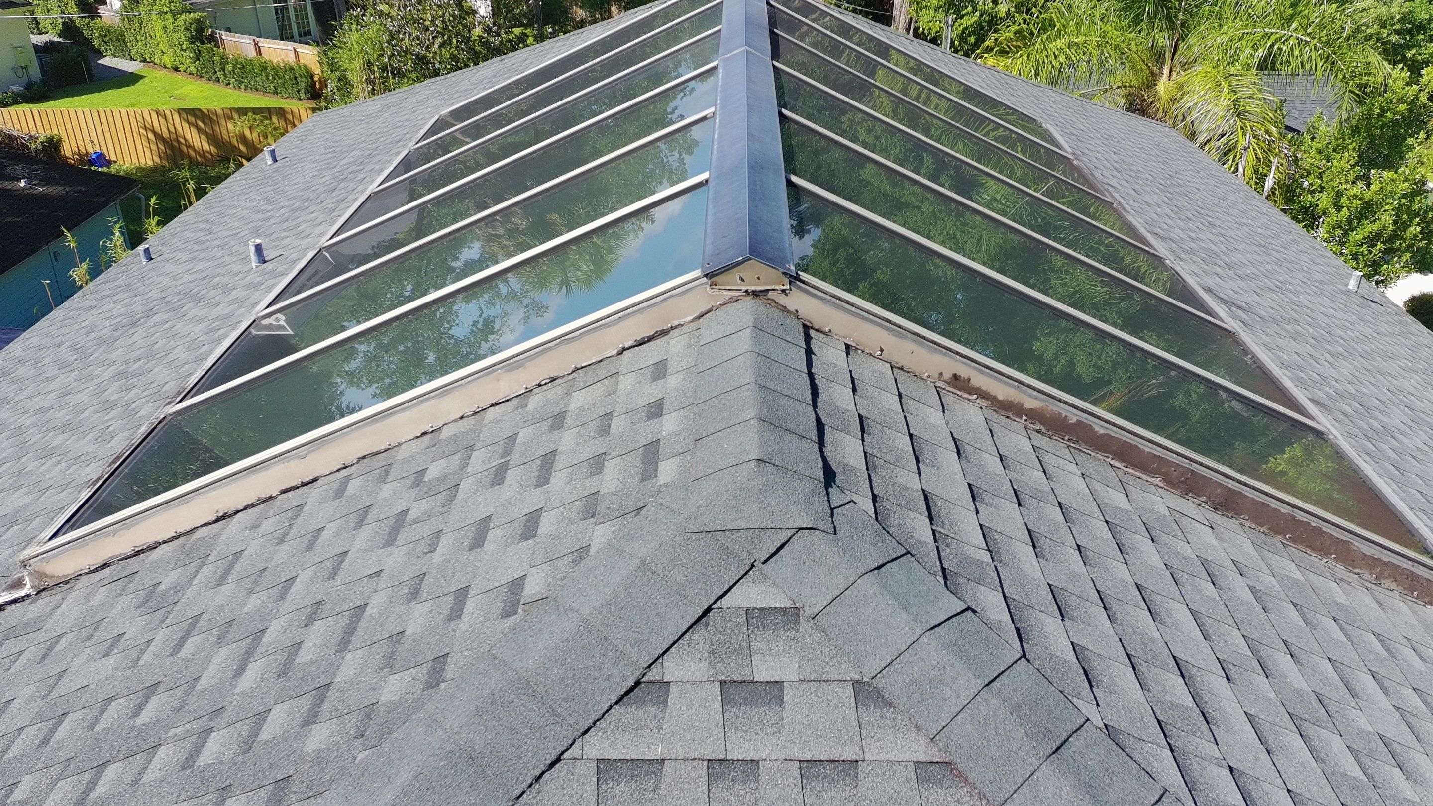 Ridge Skylight Repair and Shingle Roof Maintenance in Winter Park by Fortified Roofing Solutions Corp.