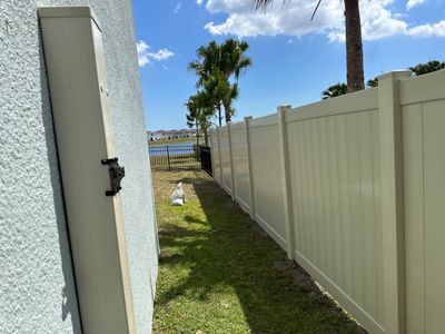 Vinyl Fence Installation using Vinyl Fence and Black 3 Rail Aluminum Fence 