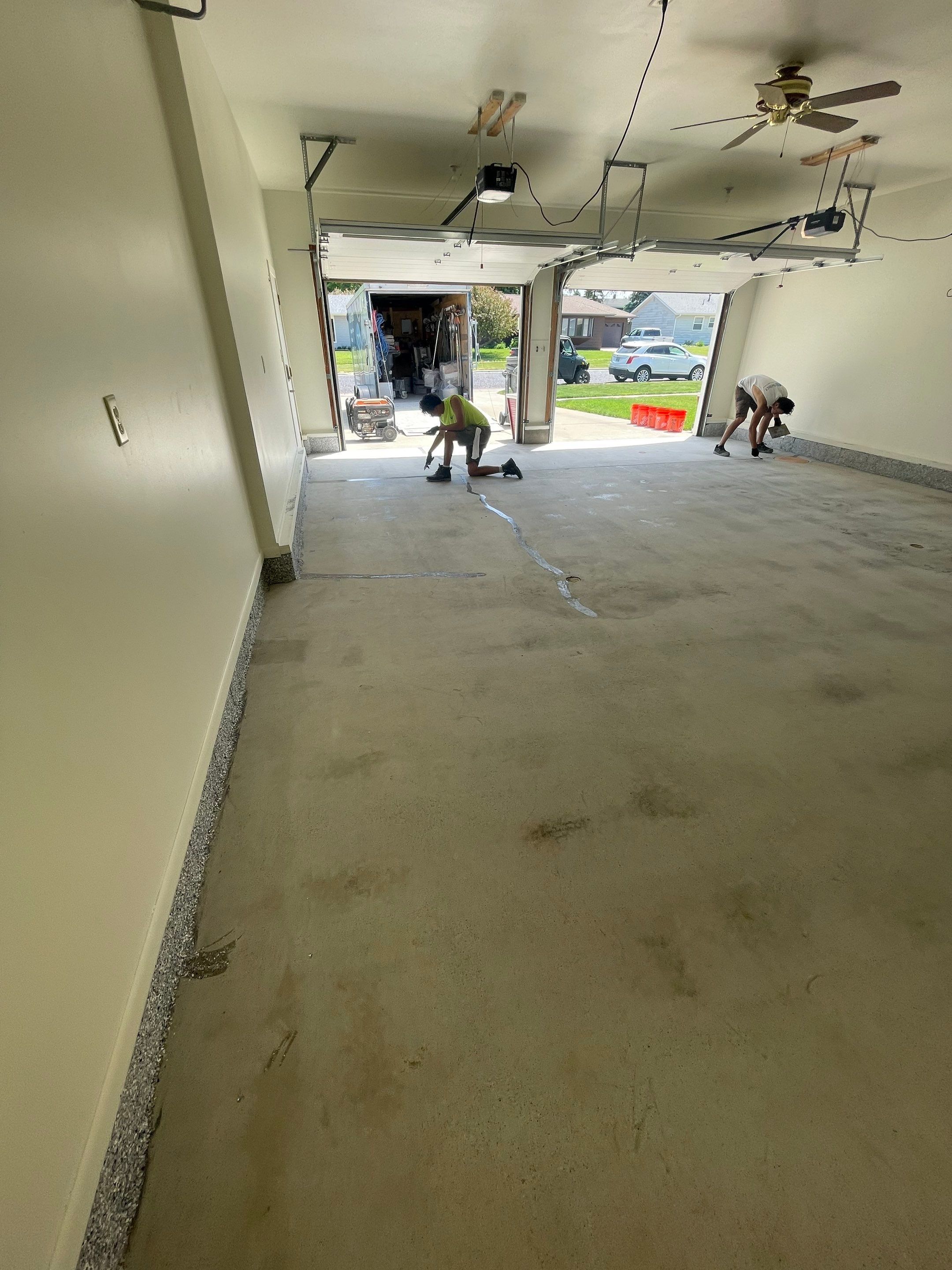 Madison Garage Concrete Coating with Feather Grey Speckle Finish by Select Painting, Coatings & Garage Cabinets