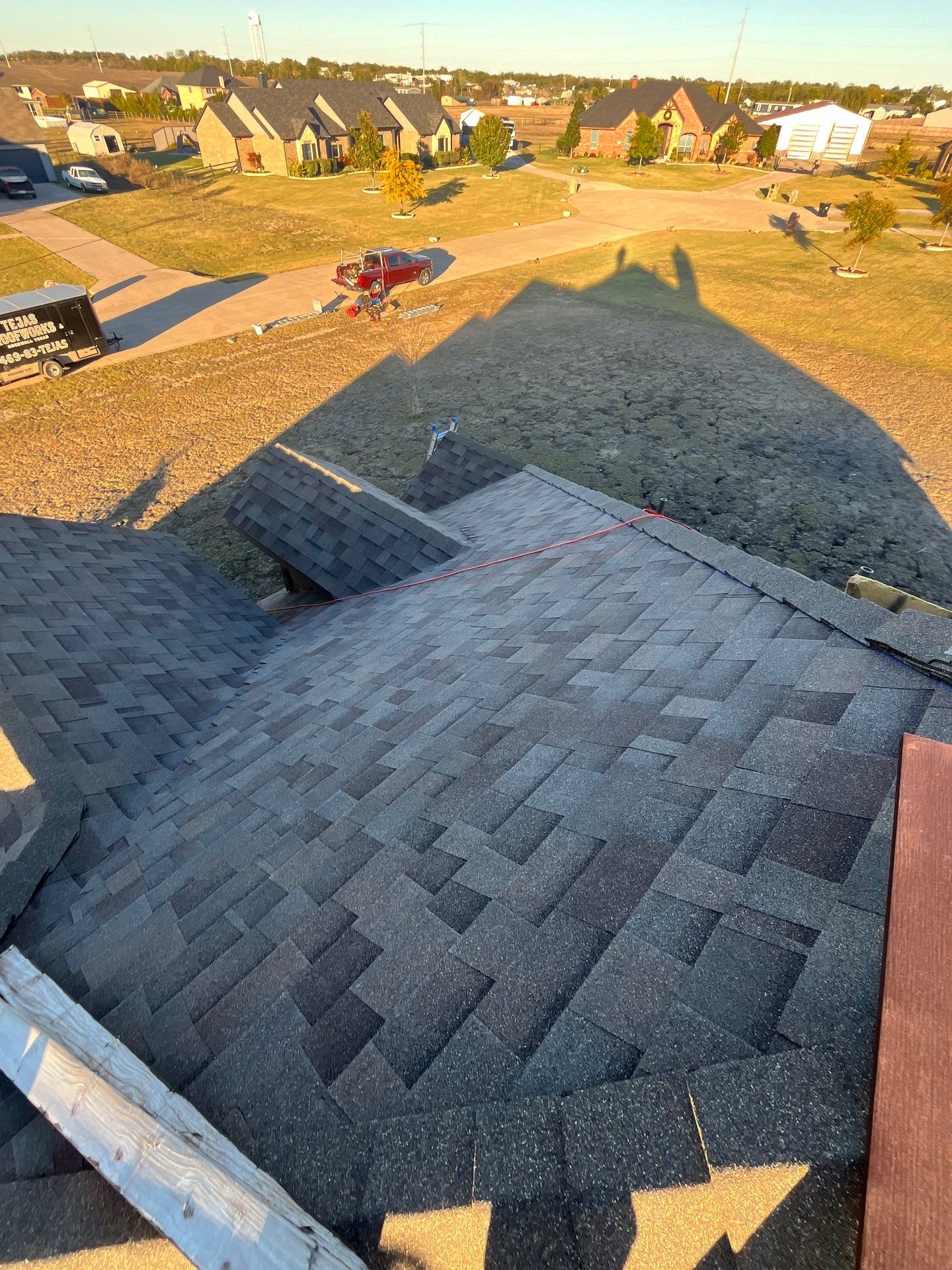 Brick with Malarkey Natural Wood by Tejas Roofworks + Restoration