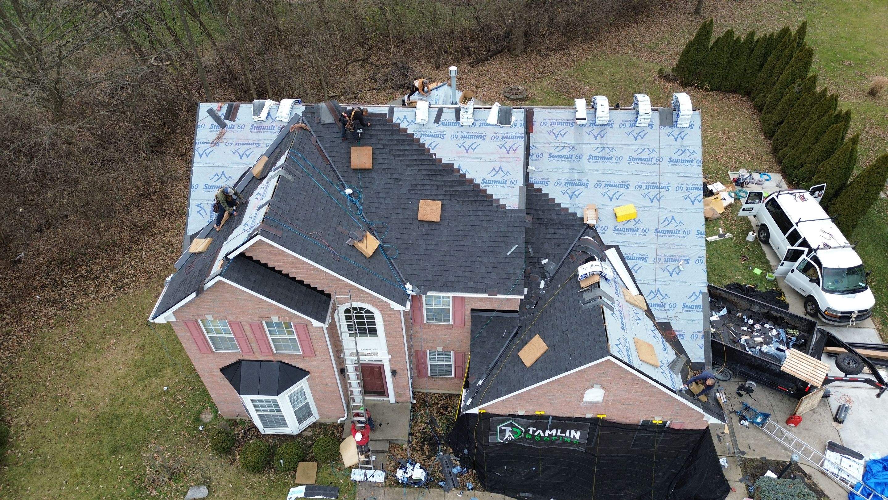 Walden Ponds - Pristine Black and Hydro Flo Gutter Guards by Tamlin Roofing