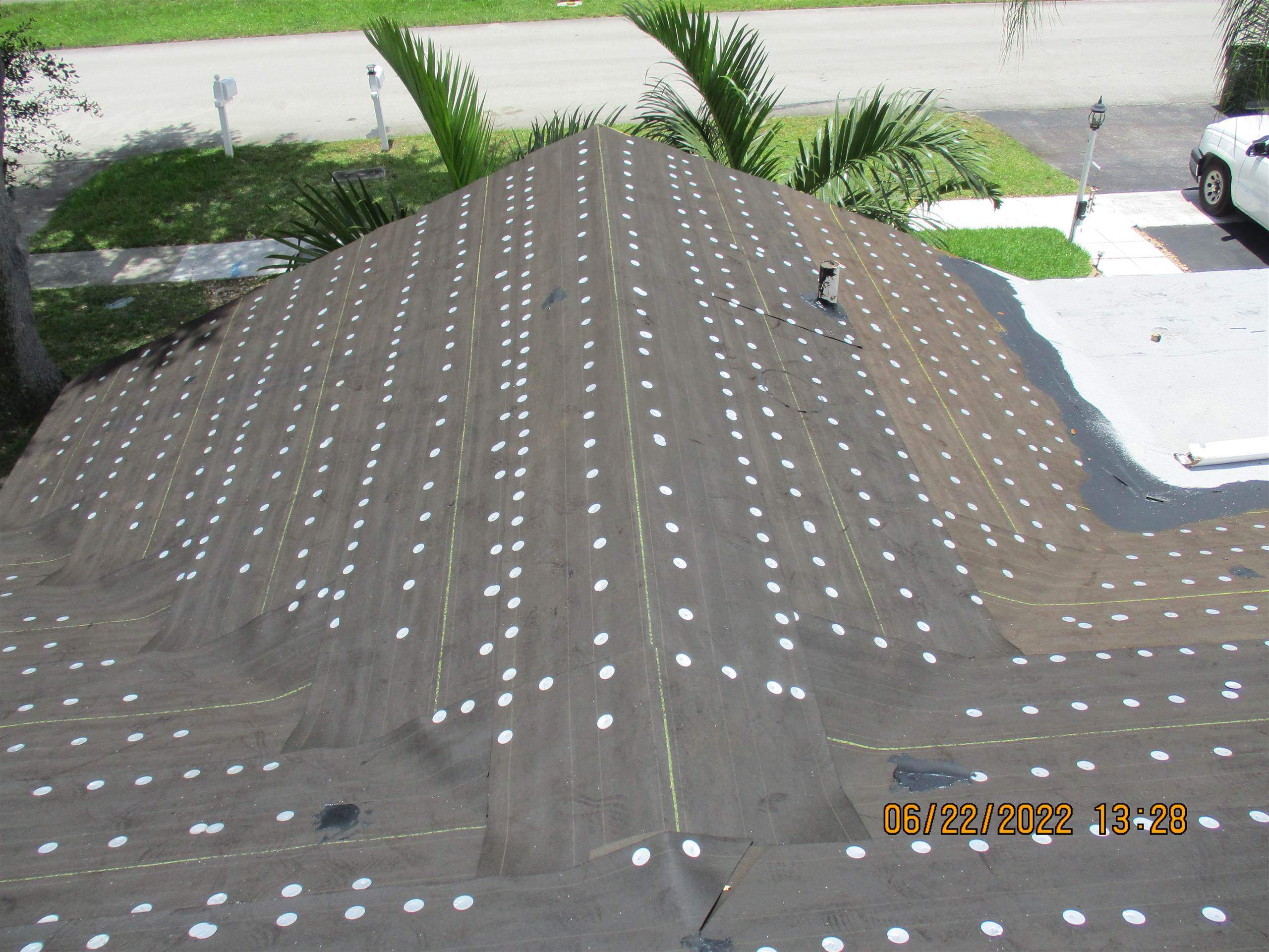 Residential Roofing Installation using 1.5" Nail Strip 24ga Solar White Kynar Coated Standing Seam Metal Panels by Morton Roofing, Inc.