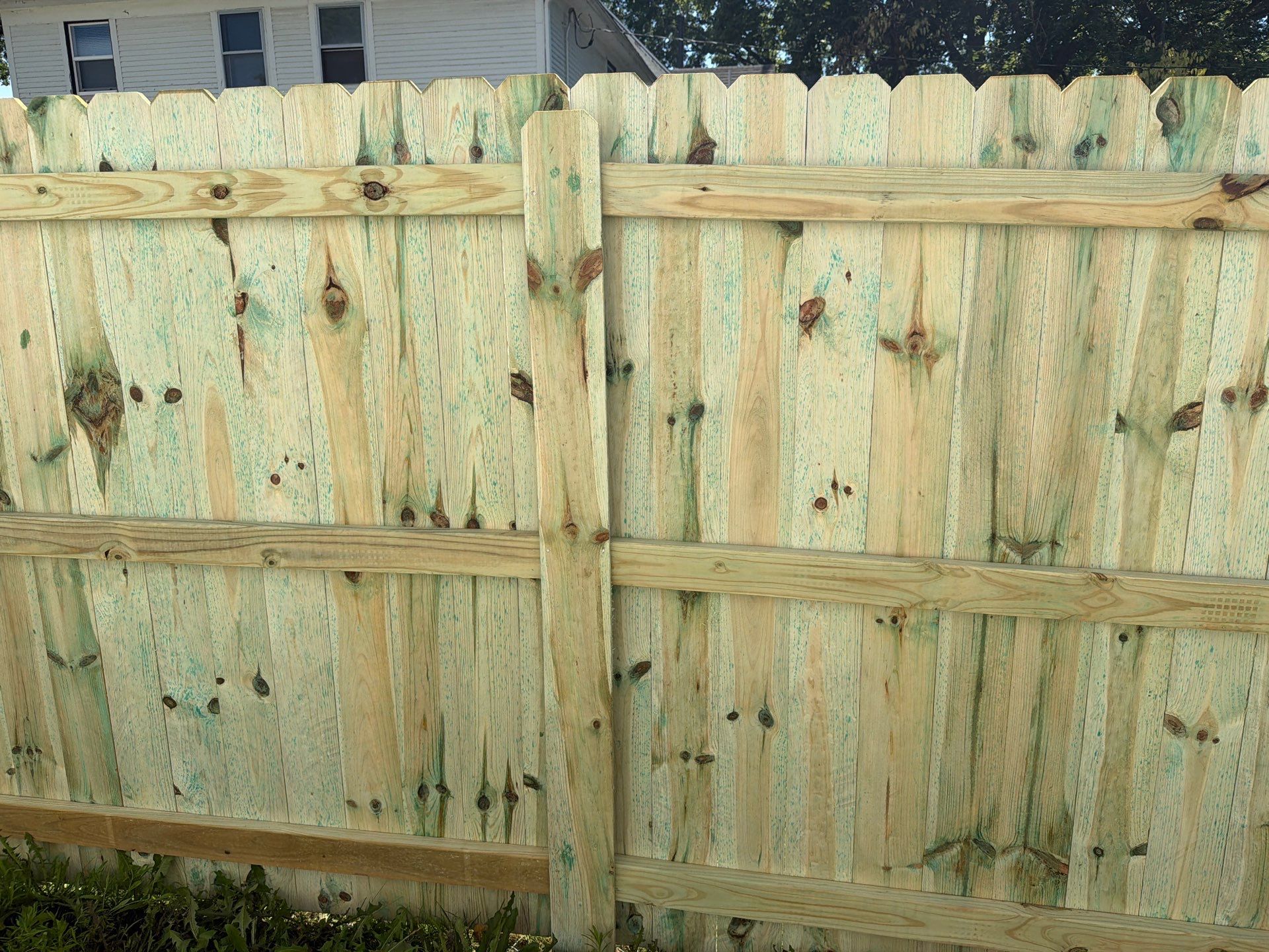 Pressure-Treated Wood Privacy Fence Installation in Waterloo by Perfect Picket Fence and Stain