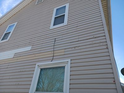 Wind damage to Siding: Insurance paid for full replacement of all siding