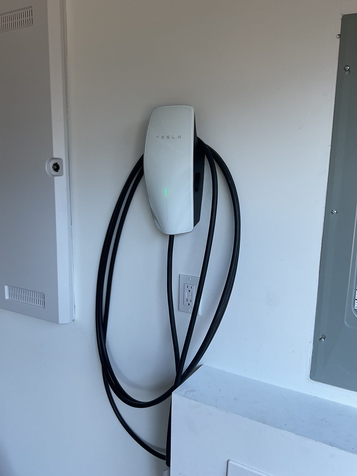 Garage-Based Tesla Charger Installation by ZAM by ZAM Electric