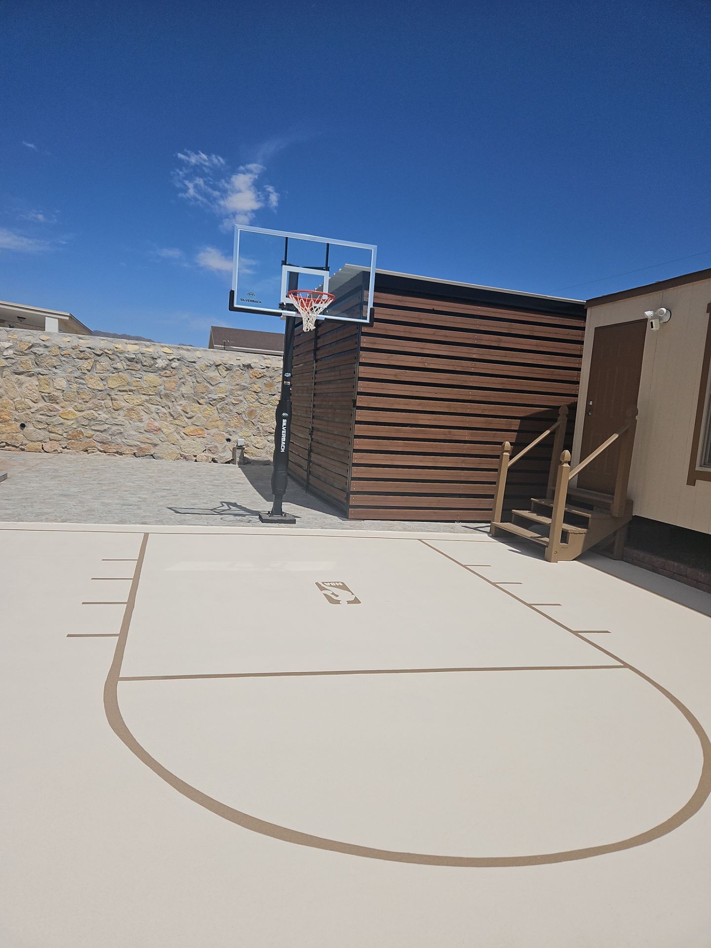 Exterior Building Painting and Repairs with Basketball Court and Playground  by Regal Renovate