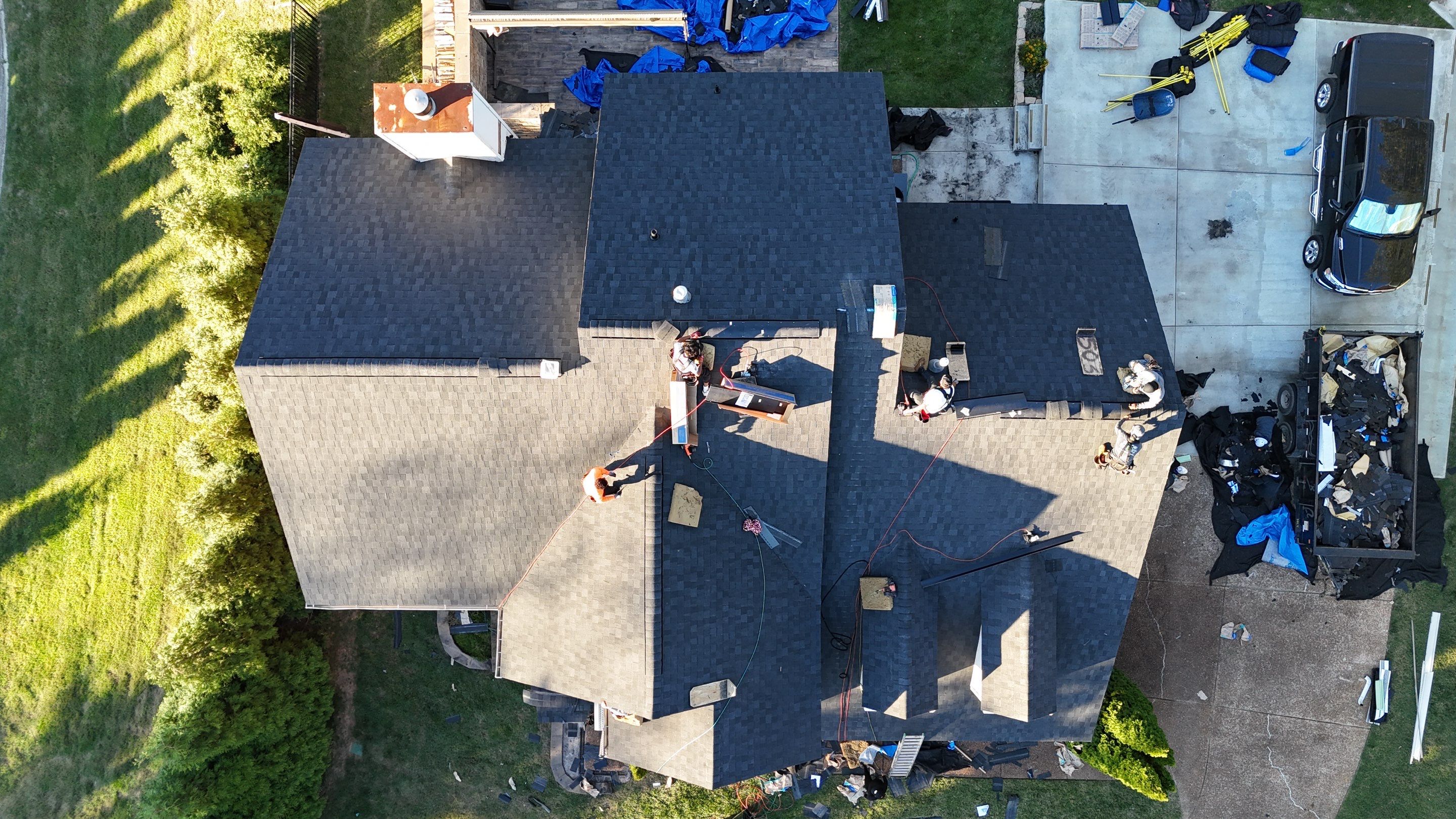 Charcoal Black Re-Roof & Gutters by Royal House LLC