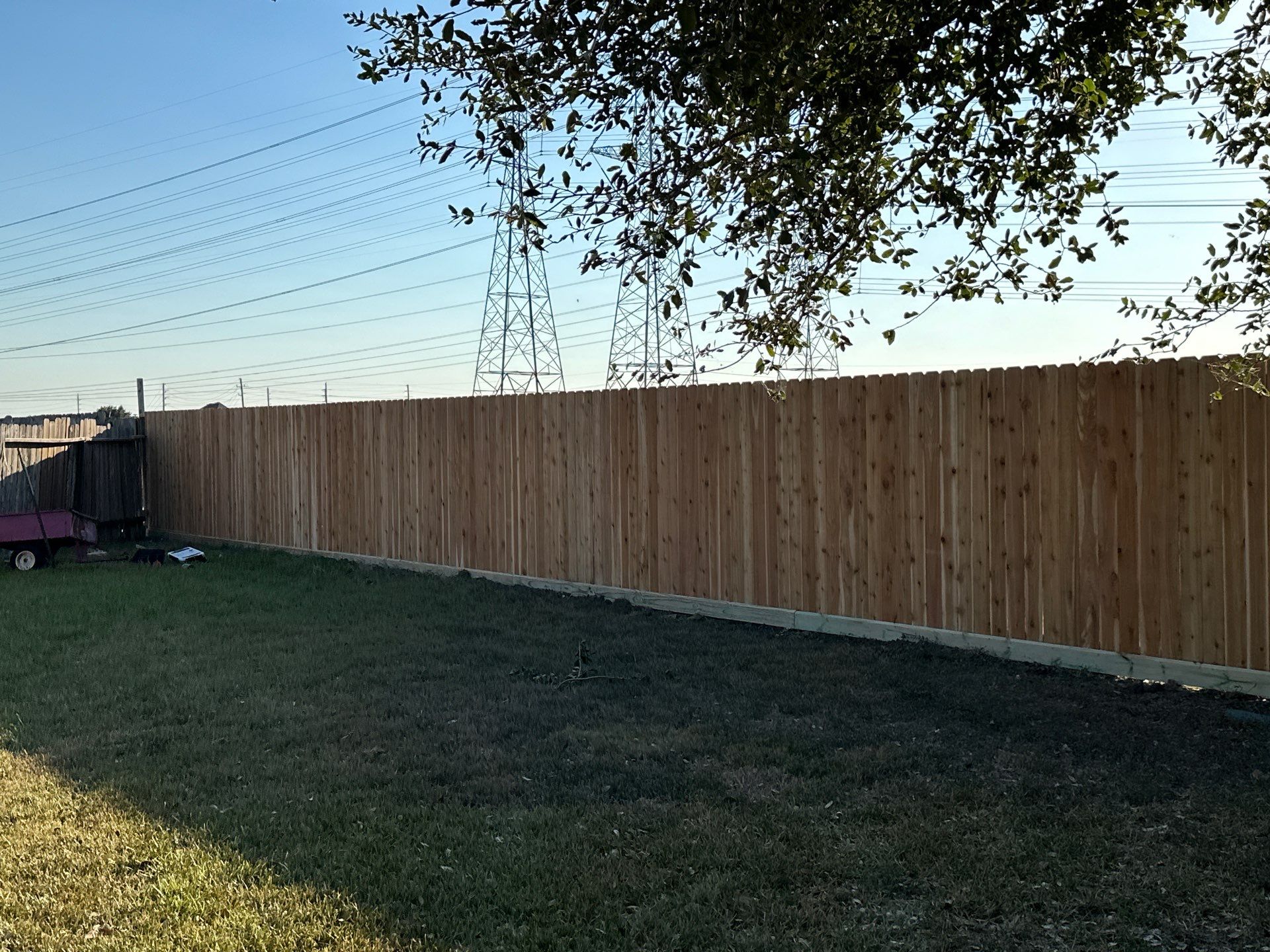 Beautiful Wood fence with metal posts by Tim's Fences