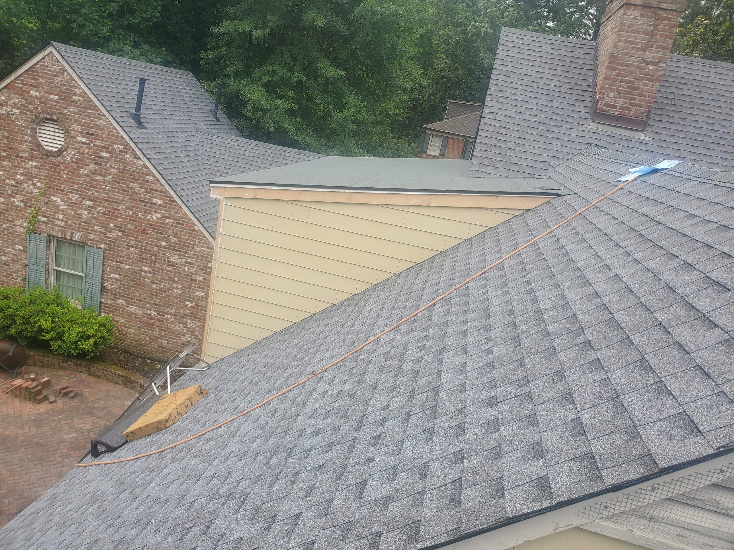 Full Roof Replacement with gutter upgrade after tree impact damage in East Memphis by Revival Roofing Services