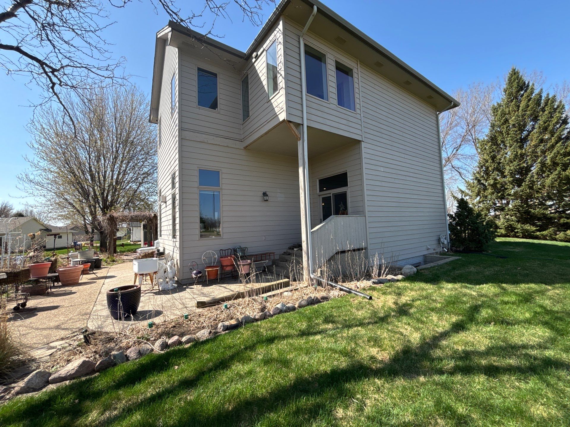 Exterior Siding and Trim Painting for Sioux Falls Residence by Select Painting, Coatings & Garage Cabinets