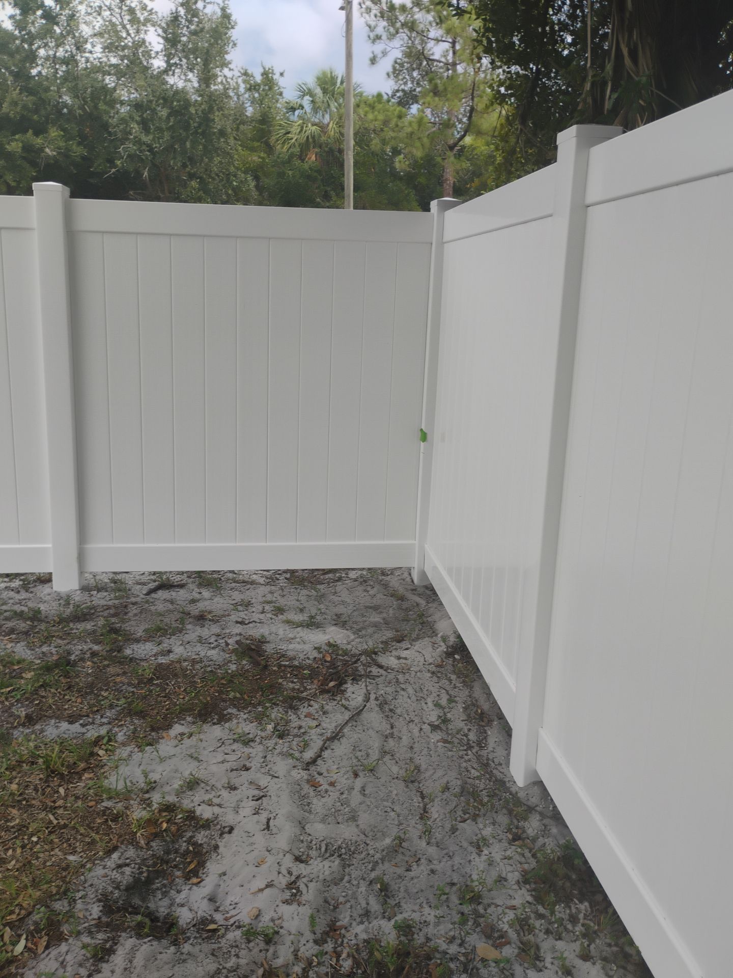 White Vinyl Privacy Fence Installation and Gate Assembly in Punta Gorda by True Fence LLC