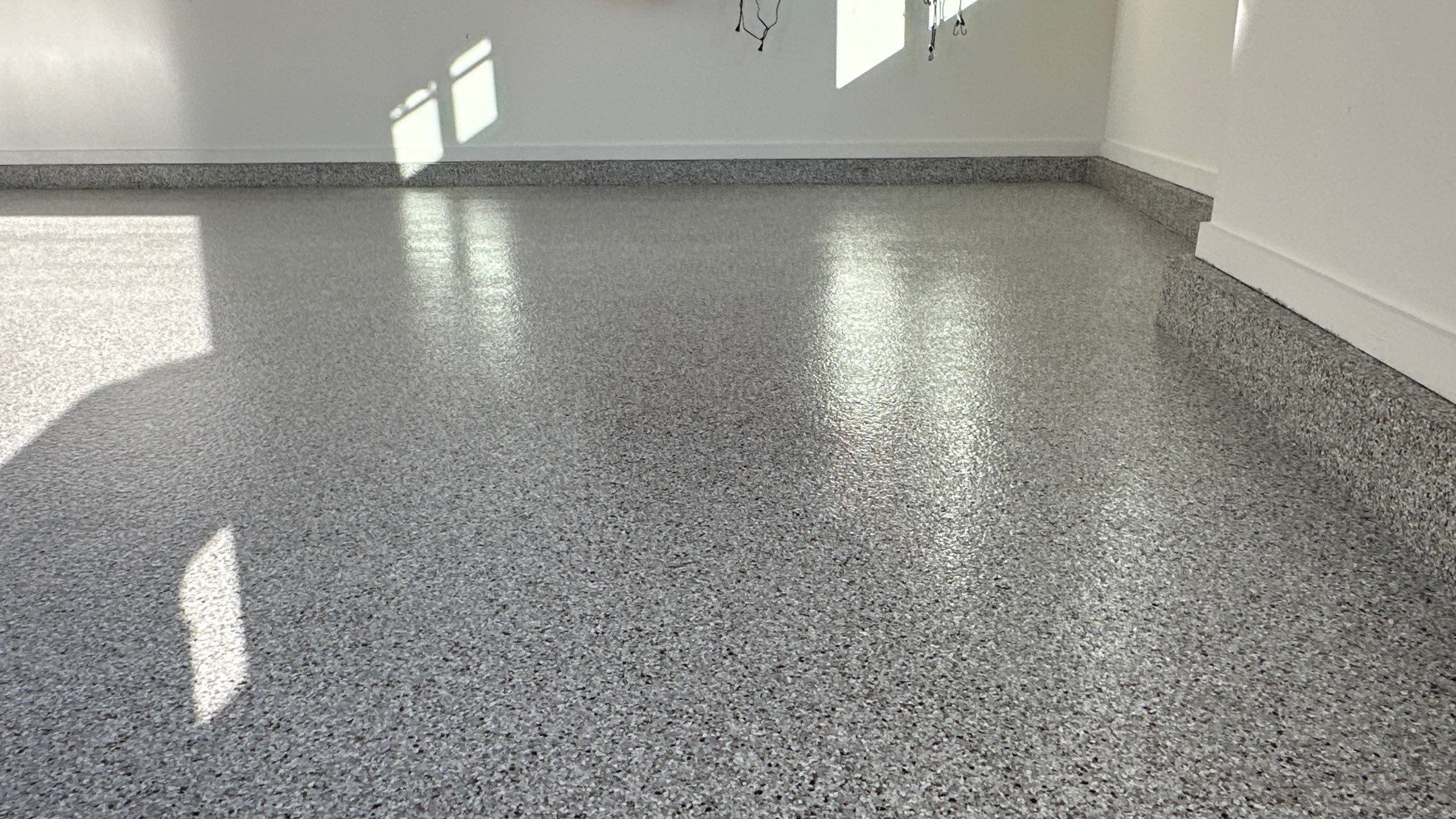Mike M. got him self a beautiful Coyote flake floor by Banner Garage